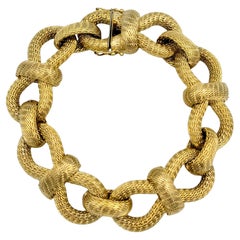 Bracciale a maglie intrecciate in oro giallo 18 carati con cerchi a maglia grossa
