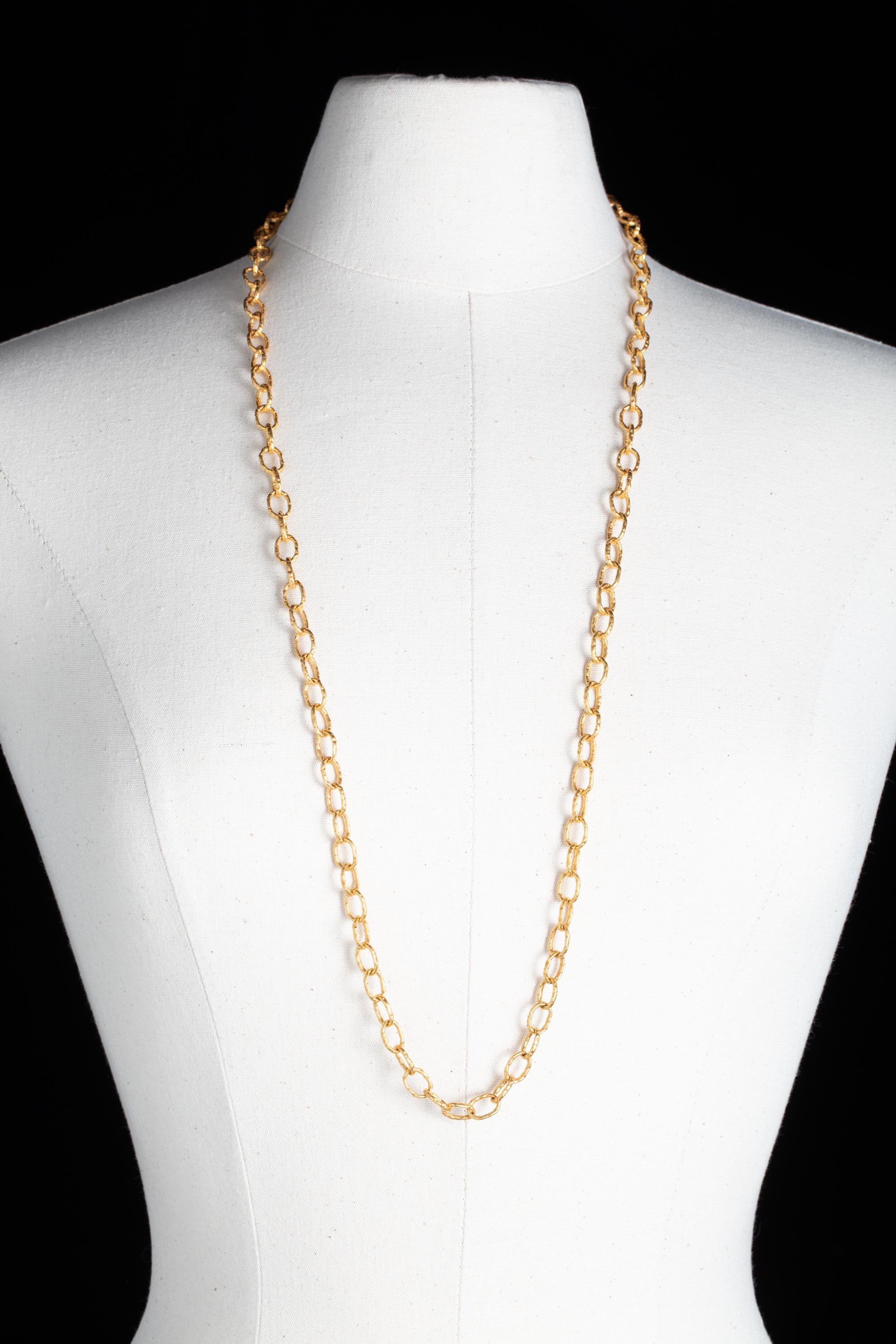 Hand-tooled 22K gold chain necklace.  Lovely textured chain long enough to double or wear long.  Double S-clasp blends in nicely.  Each link is 7/16'ths x 5/16'ths.