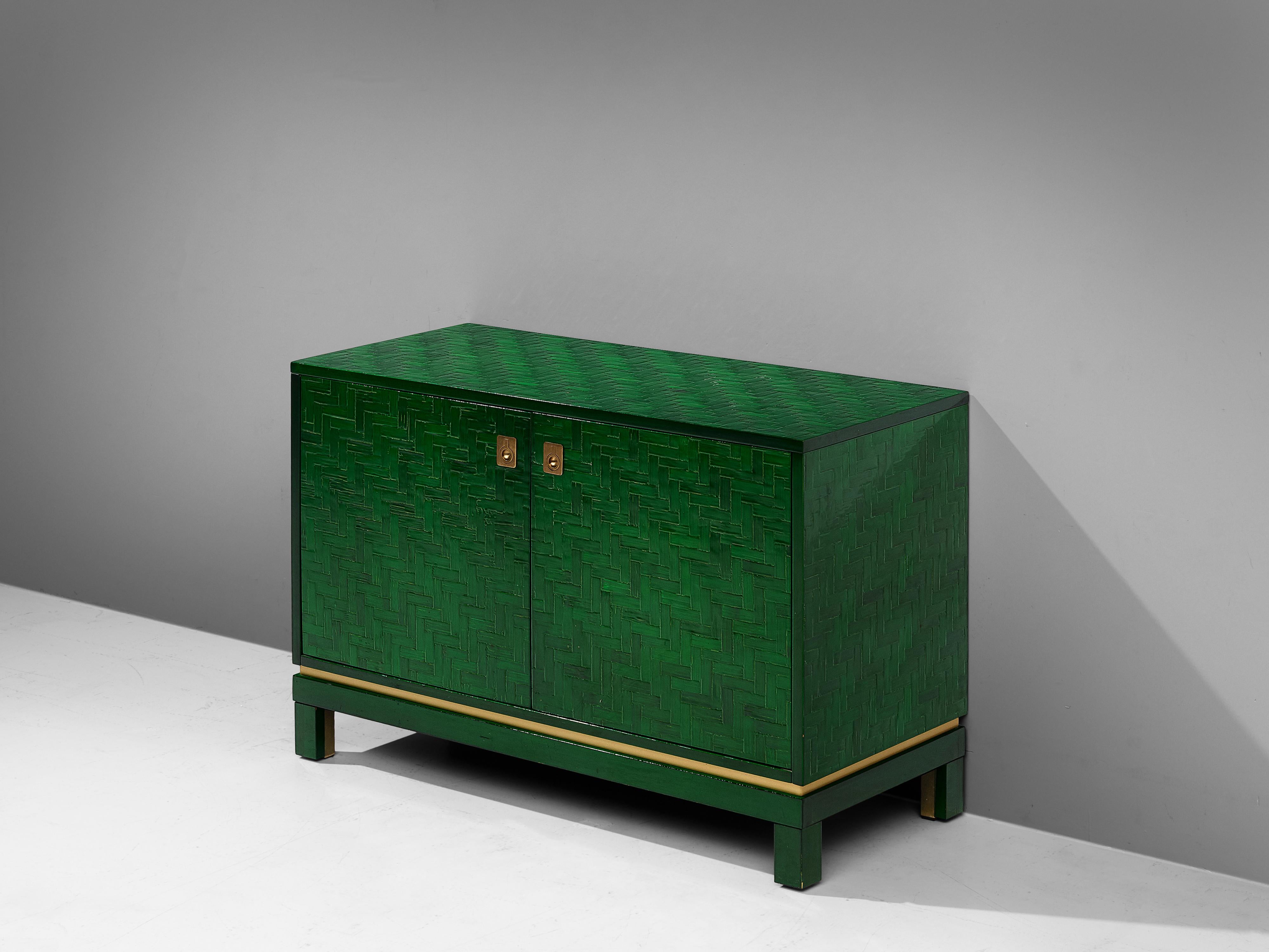 Cabinet with a lacquered slat surface and brass details, Europe, 1960s.

This lovely green cabinet show traits of a chinoiserie. The base design of this set is simple yet the finish is structured and features brass details. Another technical