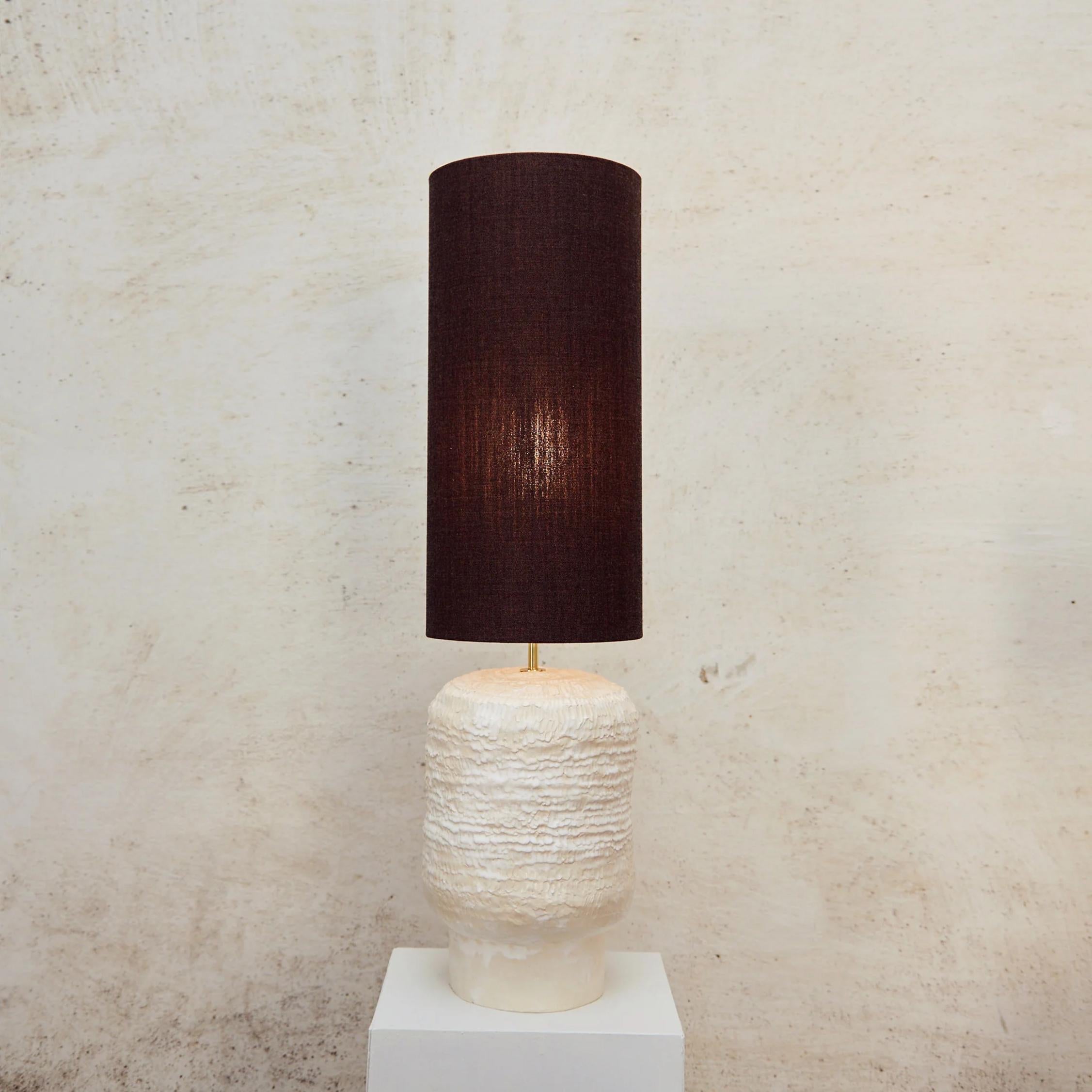 Textured Ceramic Lamp by Project 213A
Dimensions: W 23 x D 23 x H 89 cm
Materials: Ceramic, Wool, Nylon

The artisanal ceramic lights have been created inhouse and are a result of exploring traditional shapes with a playful twist on proportions