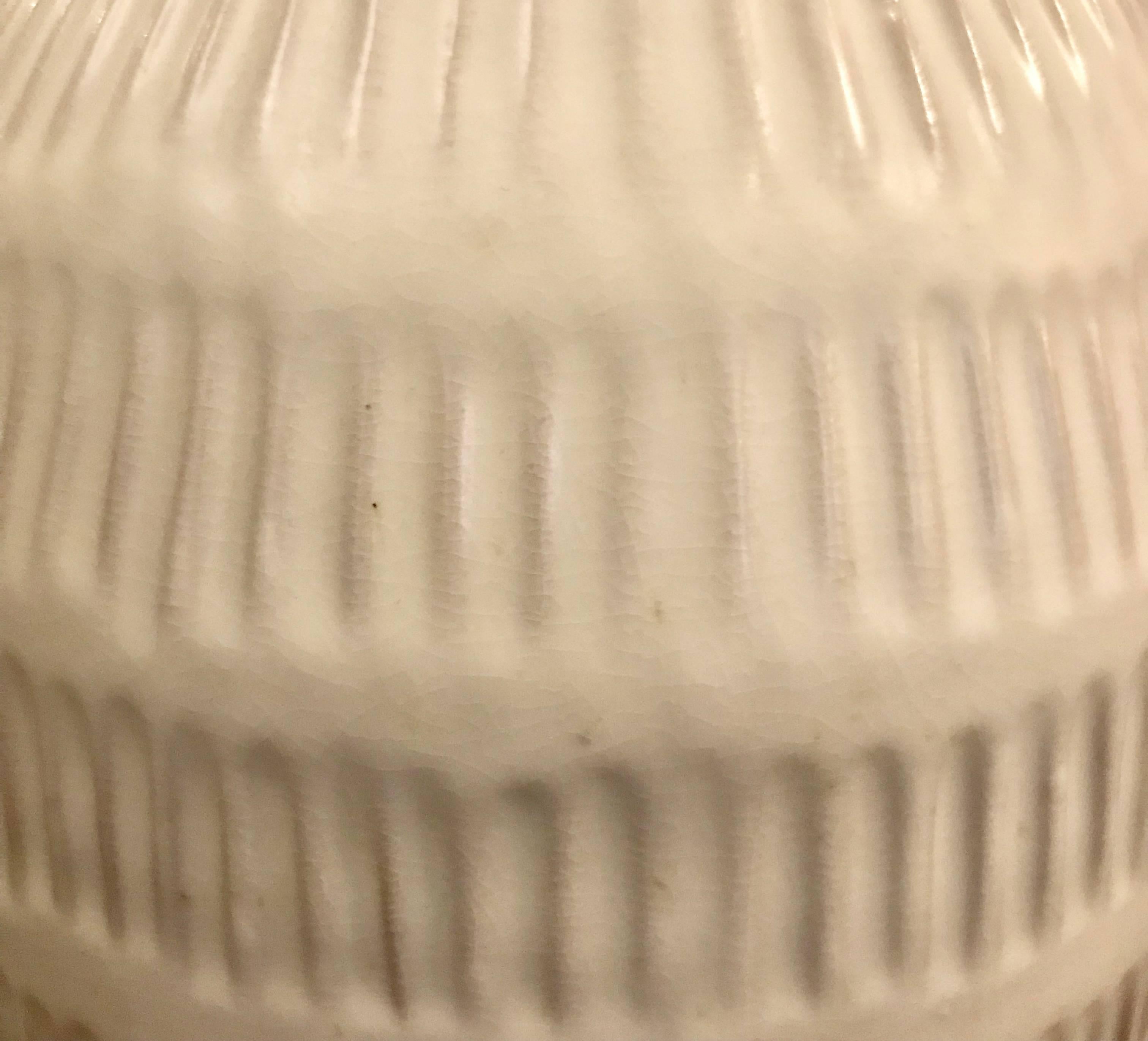 Contemporary Thailand vertically ribbed textured cream vase.
Can hold water.
Sits nicely with S4940.
 
