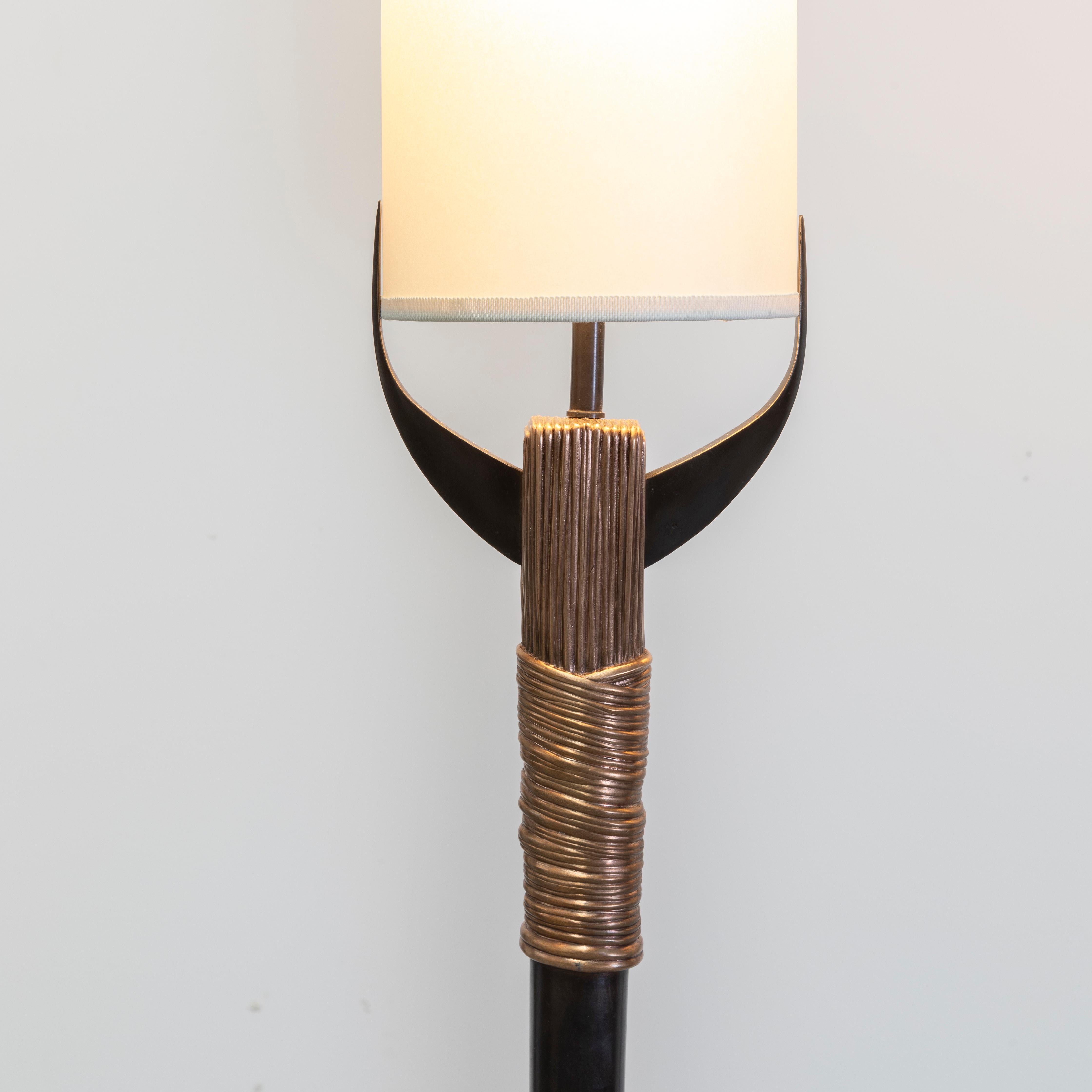 Floor lamp in bronze with textured details. The texture is nothing ordinary. Each element of a sprig wheat ear was made into a mold, carefully arranged and then cast in bronze 

Bronze floor lamps with plant inspired details. Elegant and timeless.