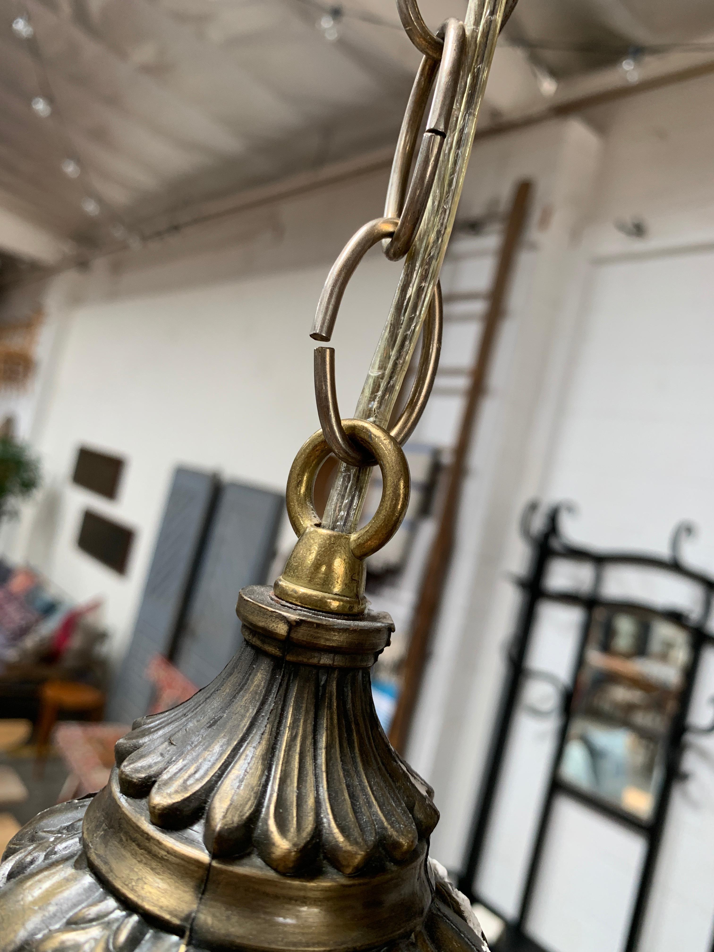 Vintage European Pendant with textured glass that creates a unique look when lit. Brass fixture is original, unscrews to allow for cleaning and bulb removal. Takes standard bulbs.