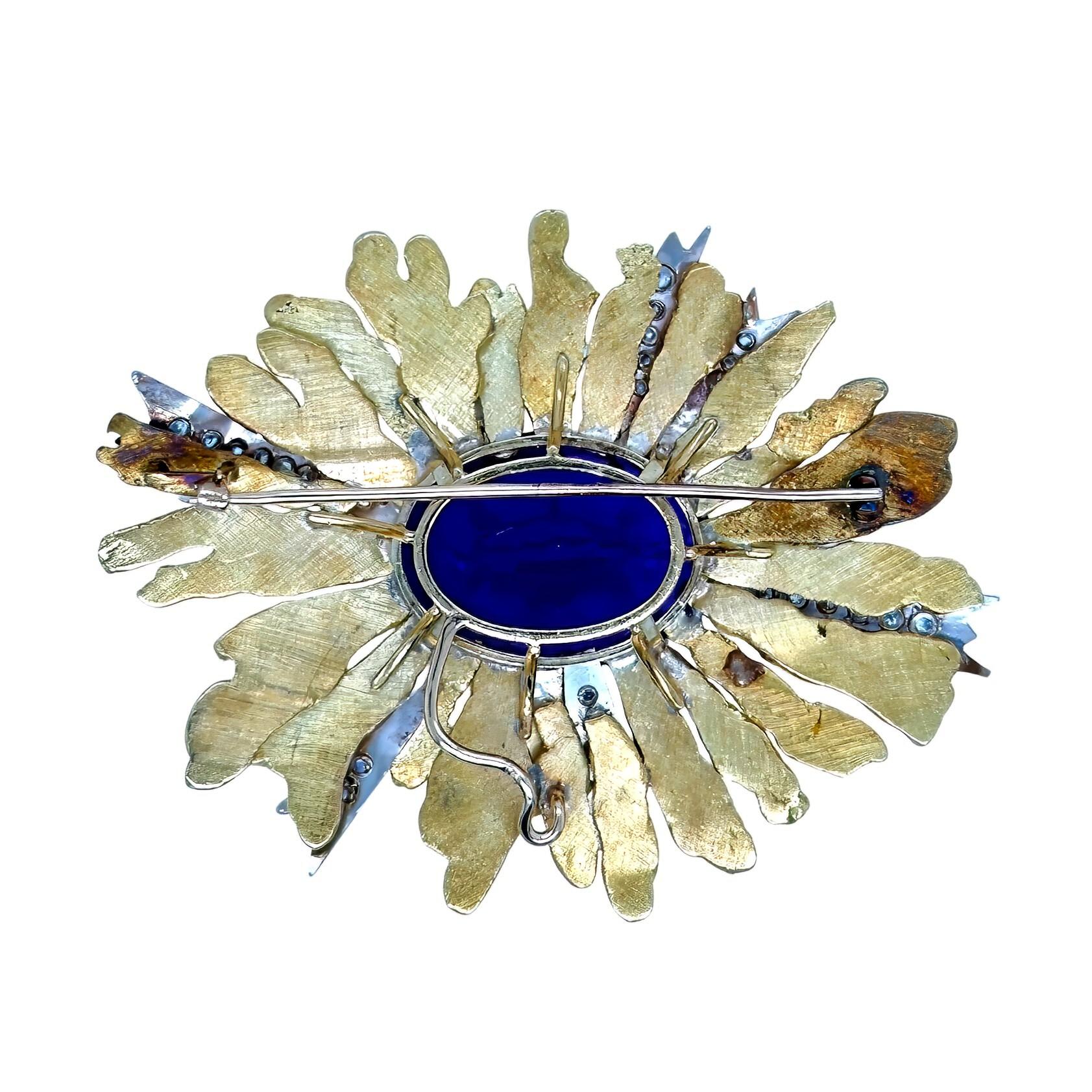 An 18 karat yellow and white gold, amethyst and diamond brooch, circa 1965.  The yellow gold brooch centering an oval faceted amethyst weighing approximately 49.90 carats within a highly textured oval sunburst motif highlighted with seven white gold