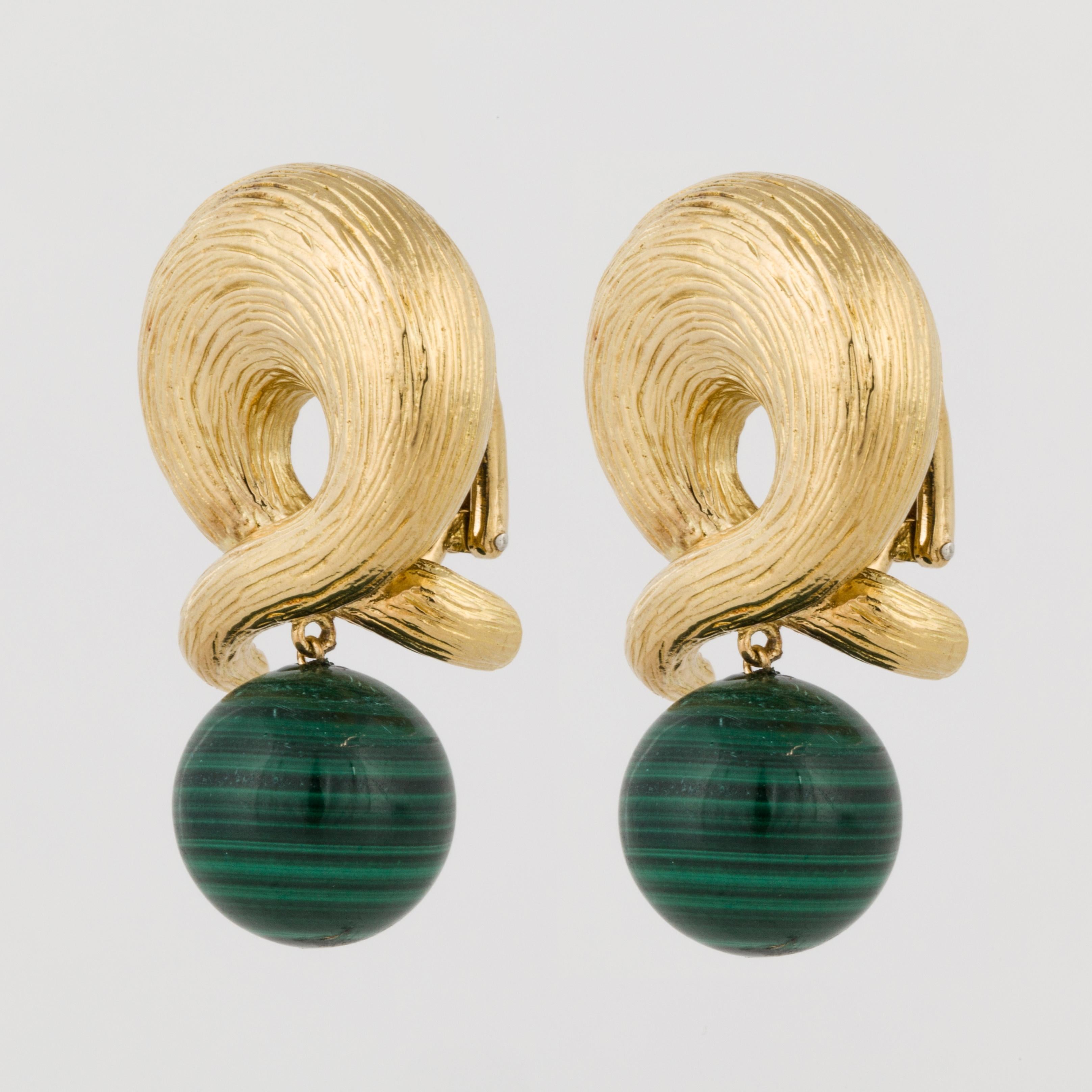 Earrings are composed of 18K yellow textured gold with a malachite bead drop.  The malachite measures 14mm, while the entire earrings measure 1 1/2 inches long and 7/8 inches wide.  These earrings are a clip style.