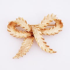 Textured Gold Bow Brooch With Stitch Detail By Crown Trifari, 1960s