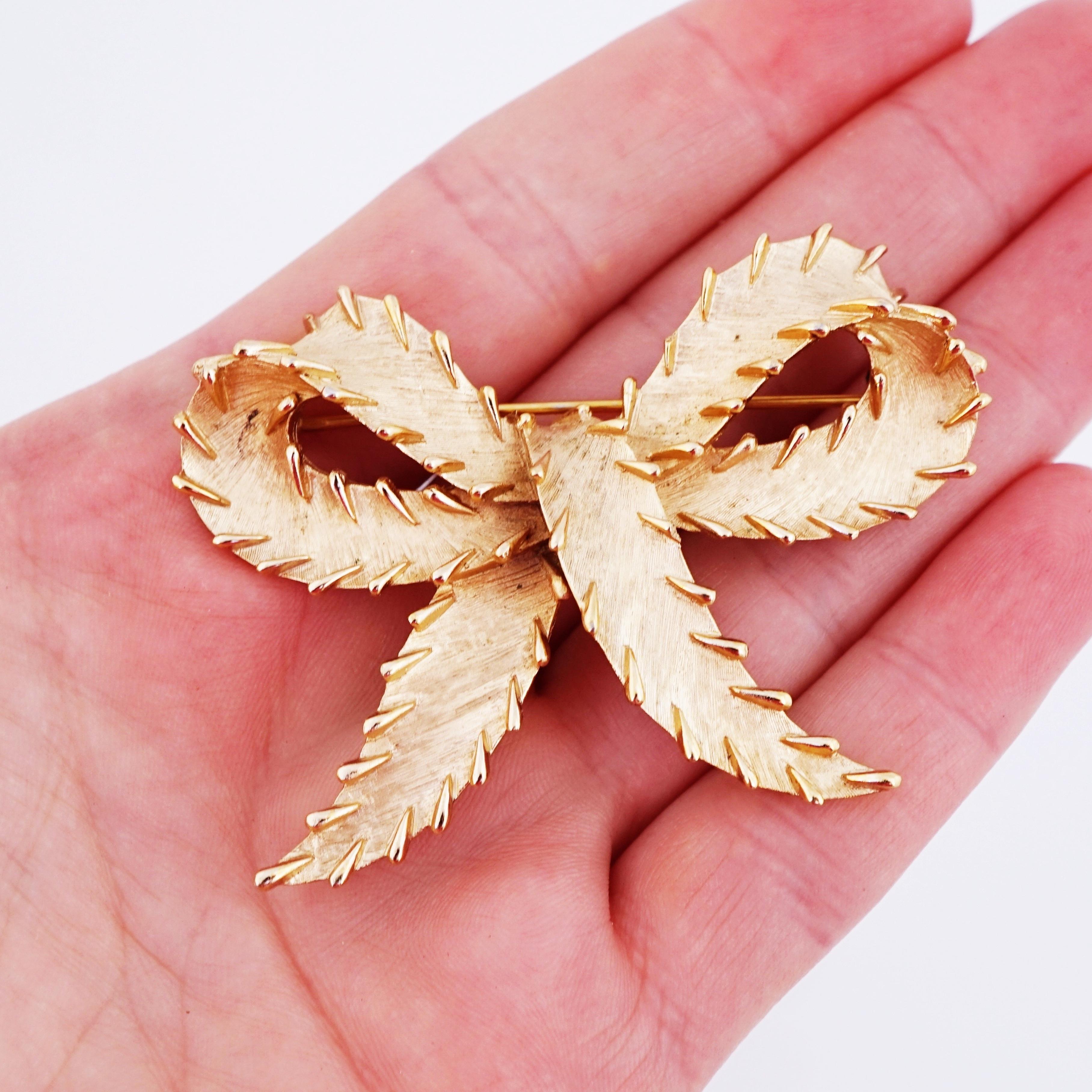 Modern Textured Gold Bow Brooch With Stitch Detail By Crown Trifari, 1960s For Sale