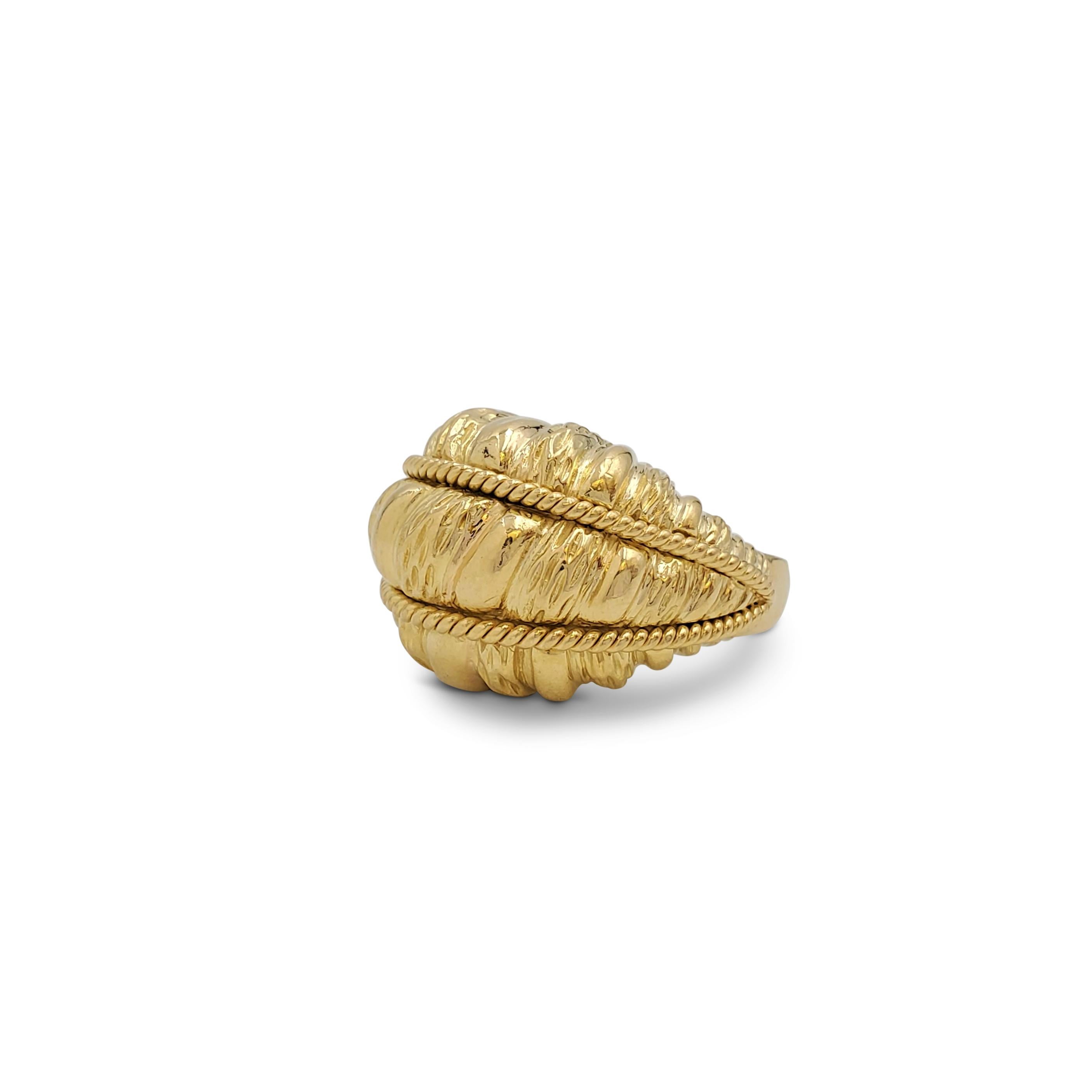 A groovy dome-shaped cocktail ring crafted in 18 karat textured yellow gold with contrasting rope detail. Marked 18K. The ring is not presented with the original box or papers. CIRCA 1970s. 

Ring Size: US 8
Box: No
Papers: No