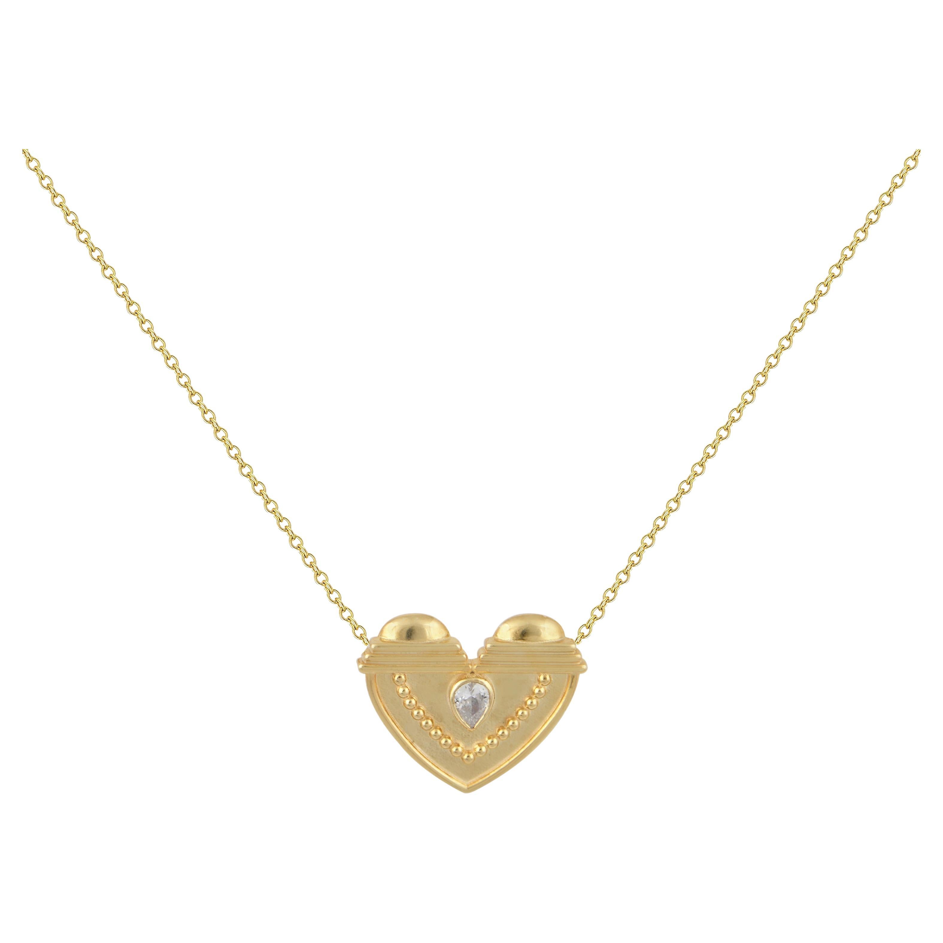Textured Heart Pendant in 18 Karat Gold With A Pear-Shaped Diamond For Sale