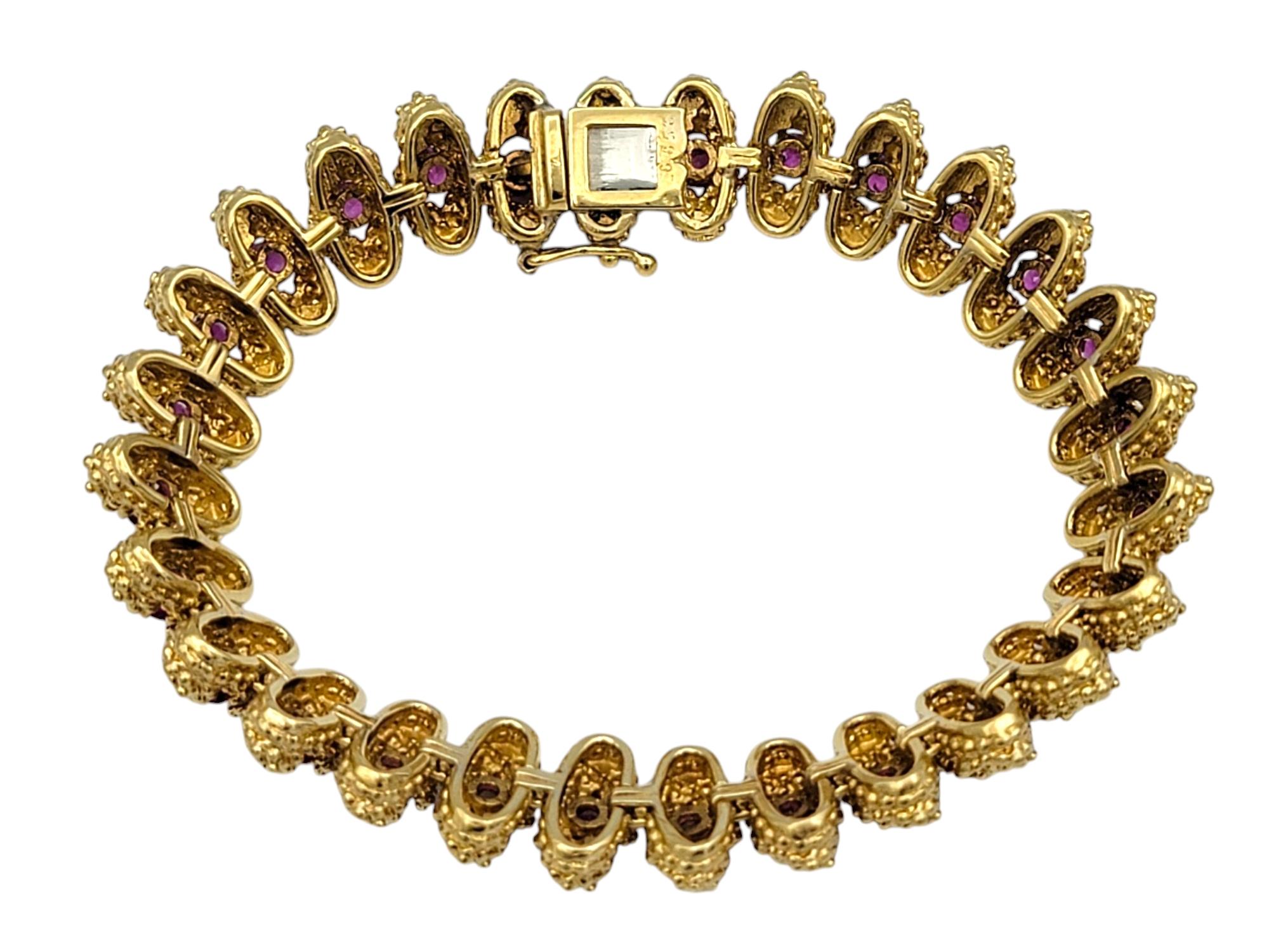 Women's Textured Metal Link Bracelet with Round Cut Rubies in 18 Karat Yellow Gold For Sale