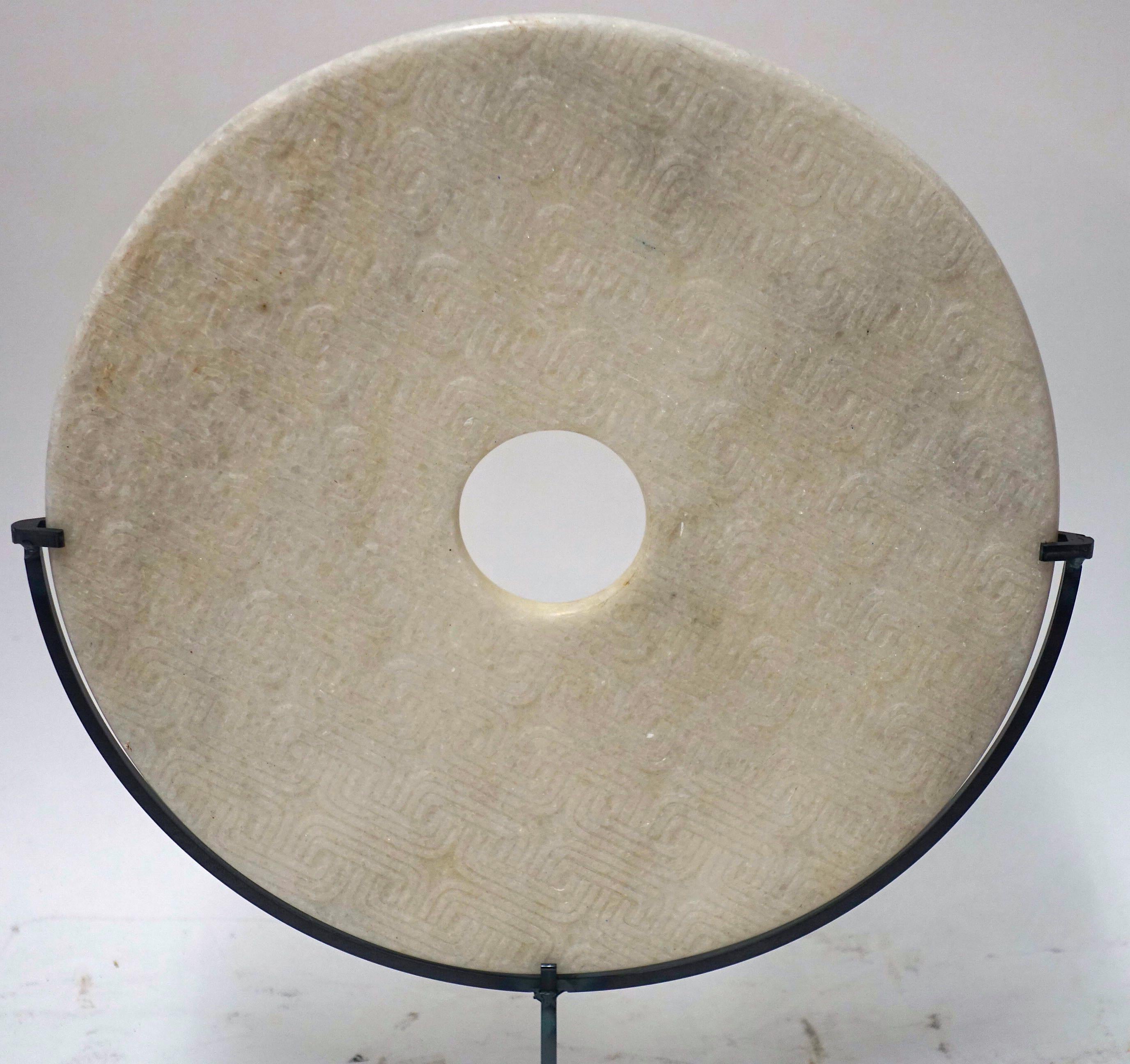 Contemporary Chinese off-white textured marble disc sculpture
Stand measures 7