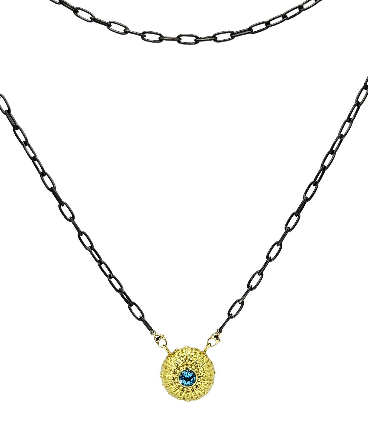 Distinctive and beautiful textured Sea Urchin Necklace in 18K green Gold with a round center 5mm bright Blue Topaz representing the ocean/sea. The unique texture including beading, flutes and high polish make this a feminine style. Perfect for