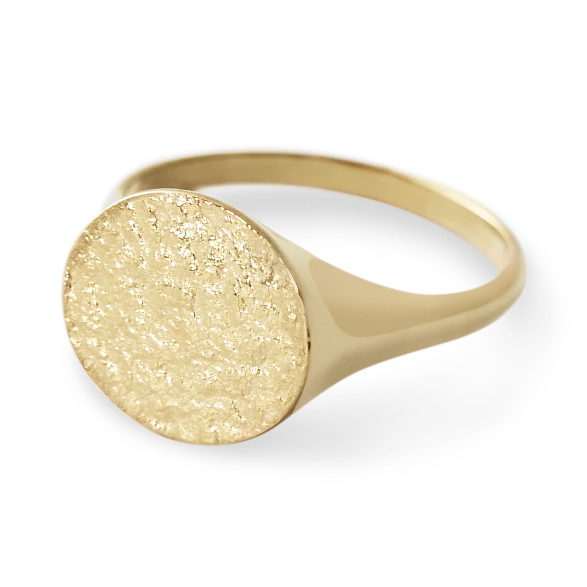 This textured signet ring crafted in solid 9-carat gold has a unique shimmering texture on the face and a high polish finish on the band for a comfortable fit.  Available in UK size M 1/2 (equivalent to US size 6 1/4), can be resized upon request at