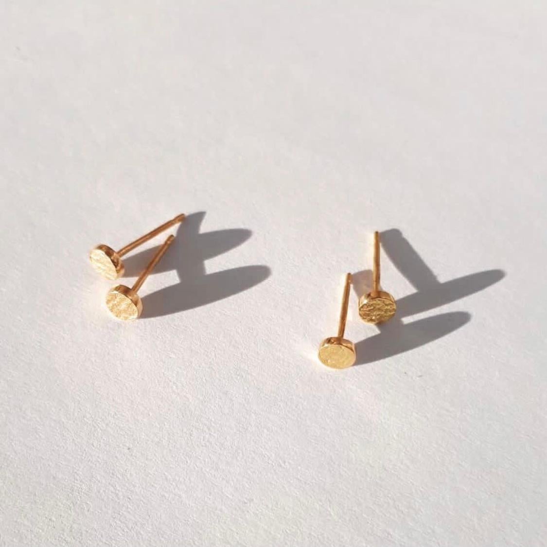 These classic gold stud earrings have a shimmering texture and high-polished edges to add a hint of shine.  Crafted in solid 9-carat gold with a post and butterfly closure. 

Handmade in London.  