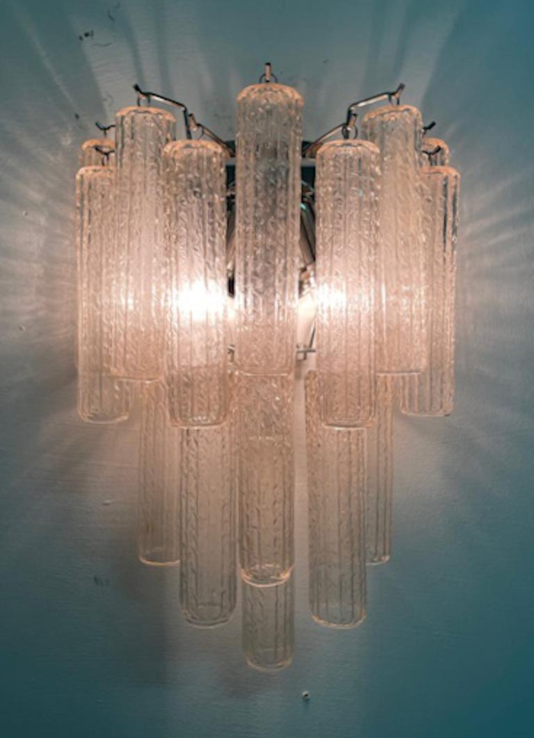 One of a kind wall lights with original vintage Italian clear textured Murano glass tubes mounted on chrome frames designed by Fabio Bergomi for Fabio Ltd / Made in Italy
2 lights / E12 or E14 type / max 40W each
Measures: Height 18 inches, width