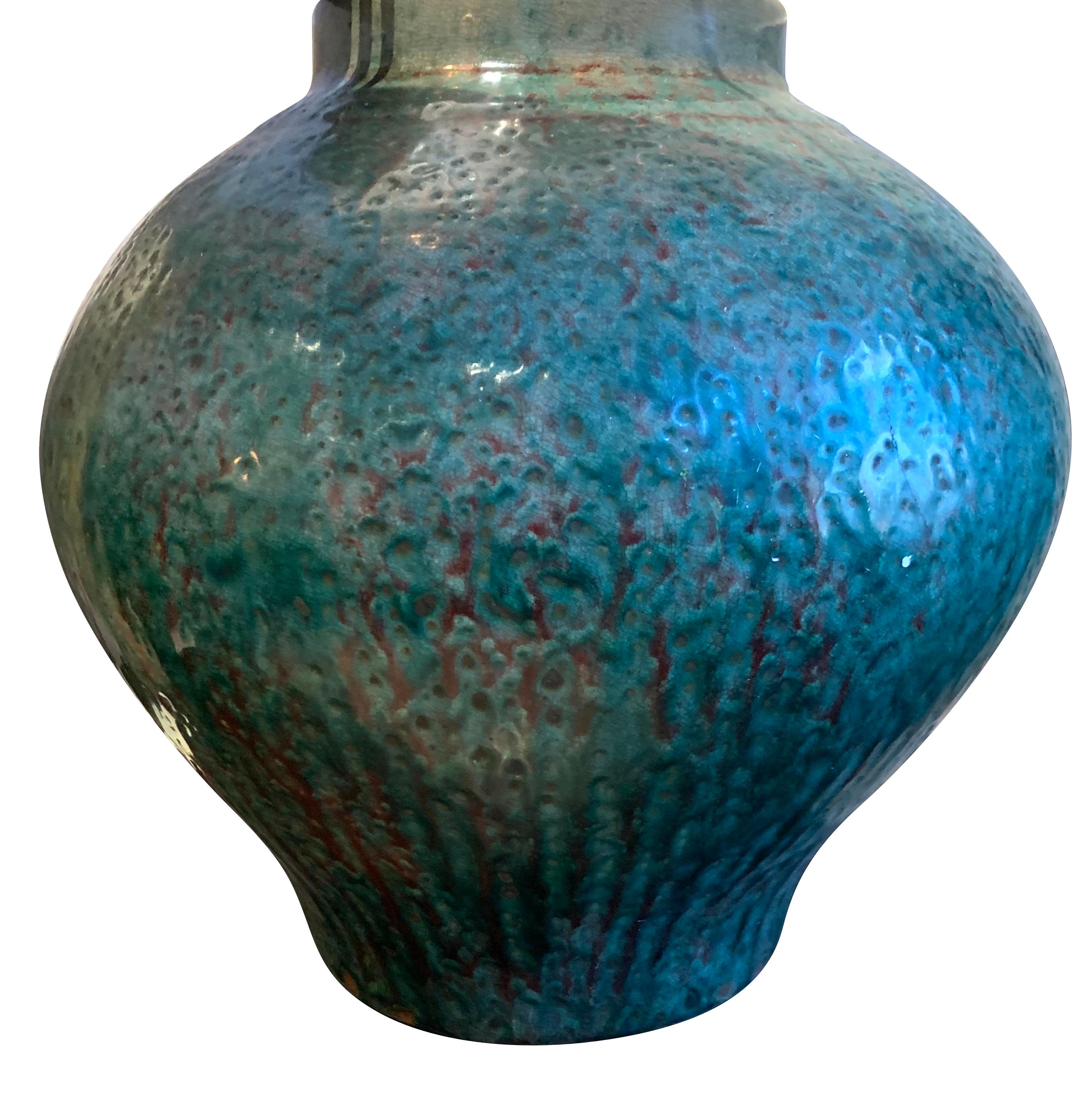 Contemporary Chinese pair of textured turquoise ginger jar shaped lamps.
Burgundy undertone color.
Base measures 14