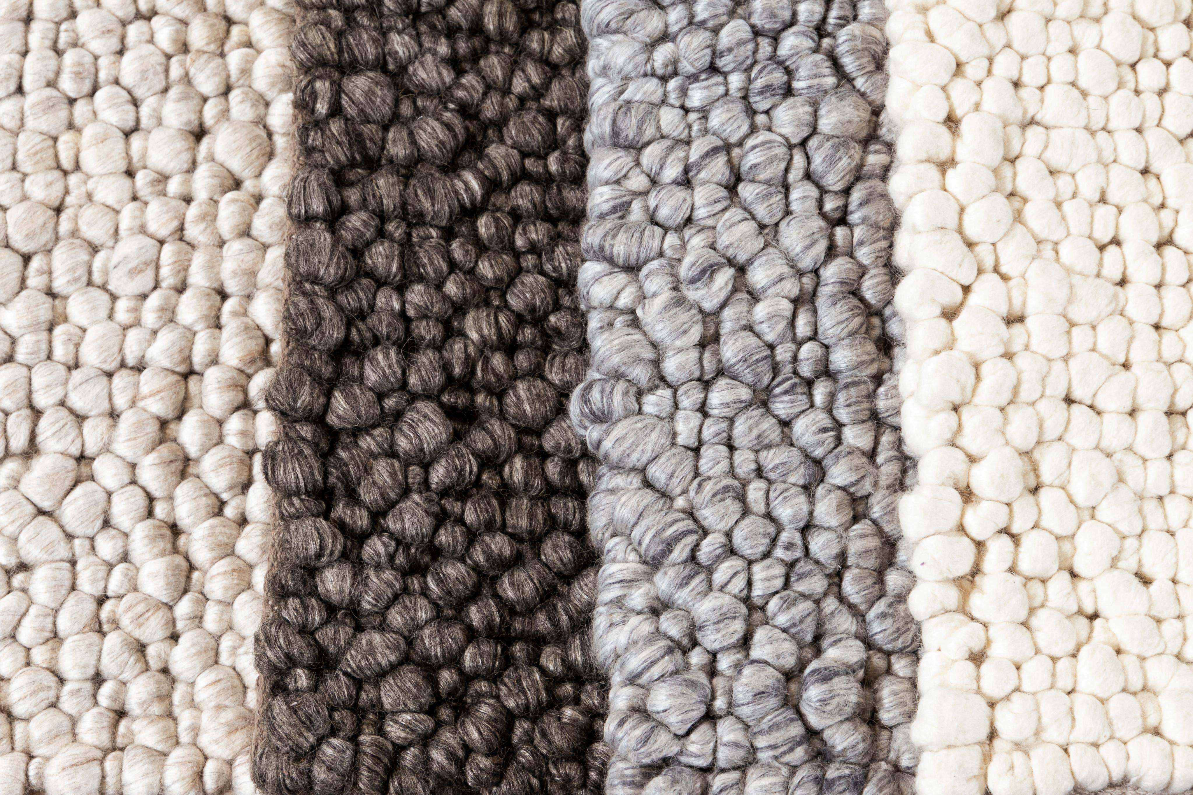 Textured wool custom rug. Custom sizes and colors made-to-order.

Material: New Zealand Wool
Lead time: Approx. 12 weeks
Available colors: As shown; other custom colors and styles available.
Made in India.