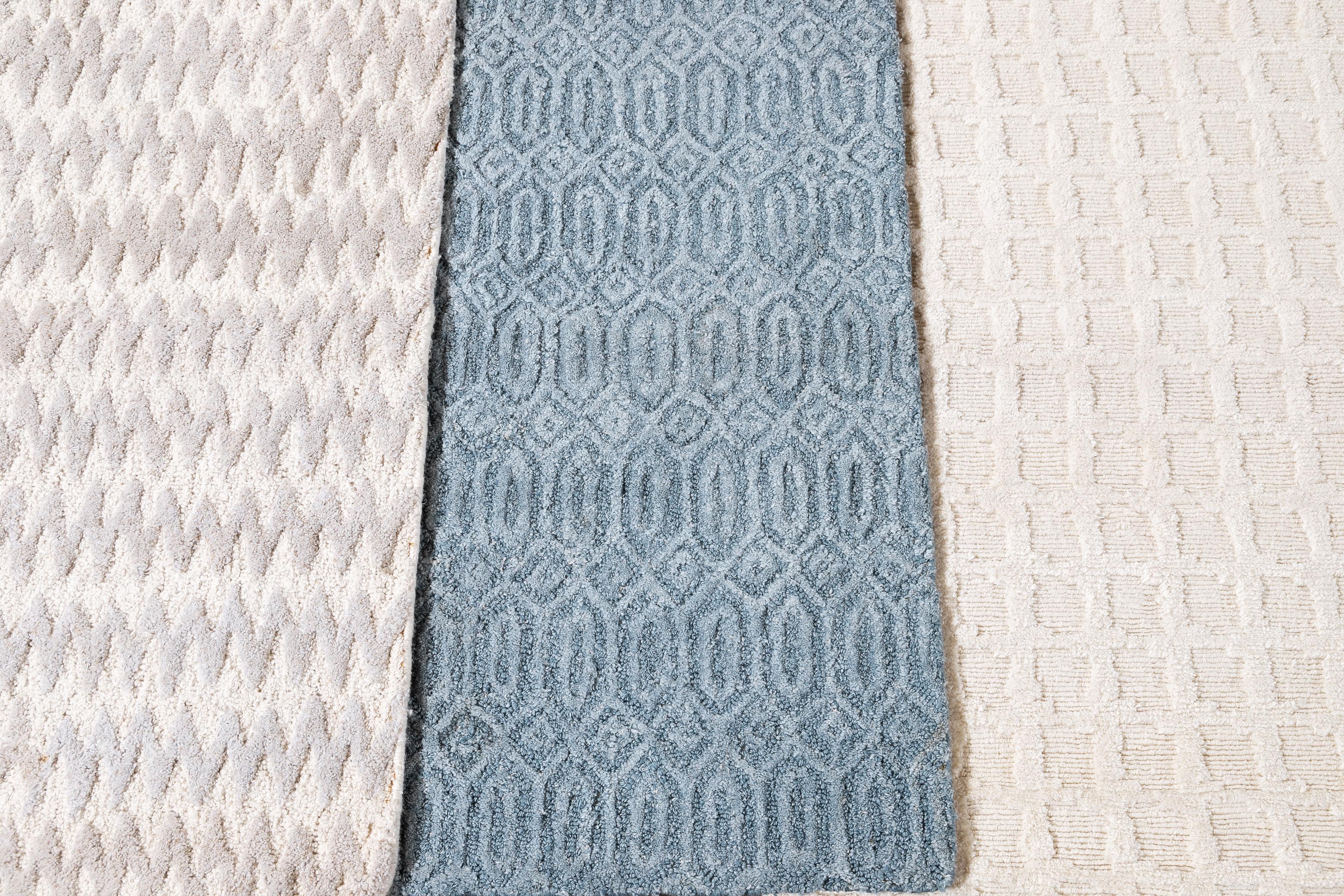 Solid-colored wool textured custom rug. Custom sizes and colors made-to-order. 

Material: Wool 
Lead Time: Approx. 15-20 weeks Available 
Colors: As shown (Ivory, Blue); other custom colors and styles available 
Made in Tibet 
Price shown is