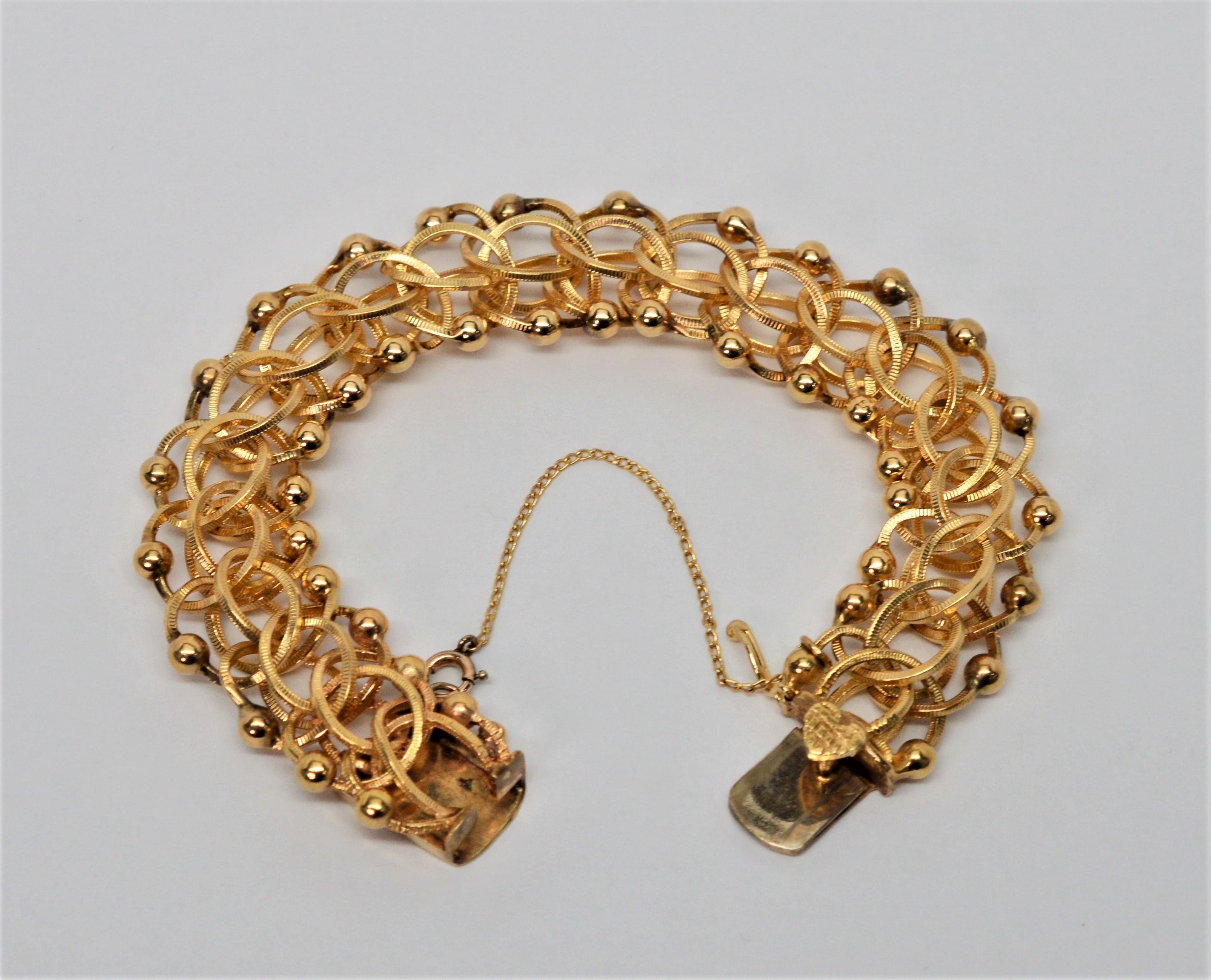 Retro Textured 14 Karat Yellow Gold Interlocking Open Link Chain Bracelet For Sale