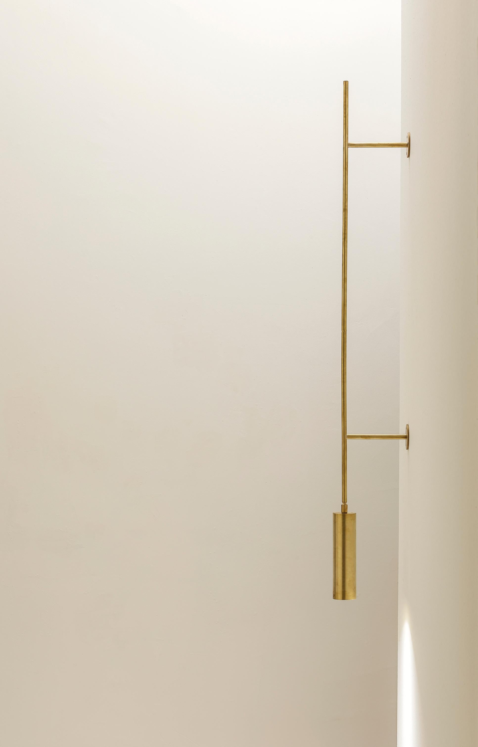 TF411 Wall Lamp in Satin Brass with an Orientable Tubular Diffuser by Daluce
Dimensions: D 16,6 x 10 x H 132 cm. 
Materials: Brass.

Available in different finish options: light satin burnished brass, medium satin burnished brass, and dark satin