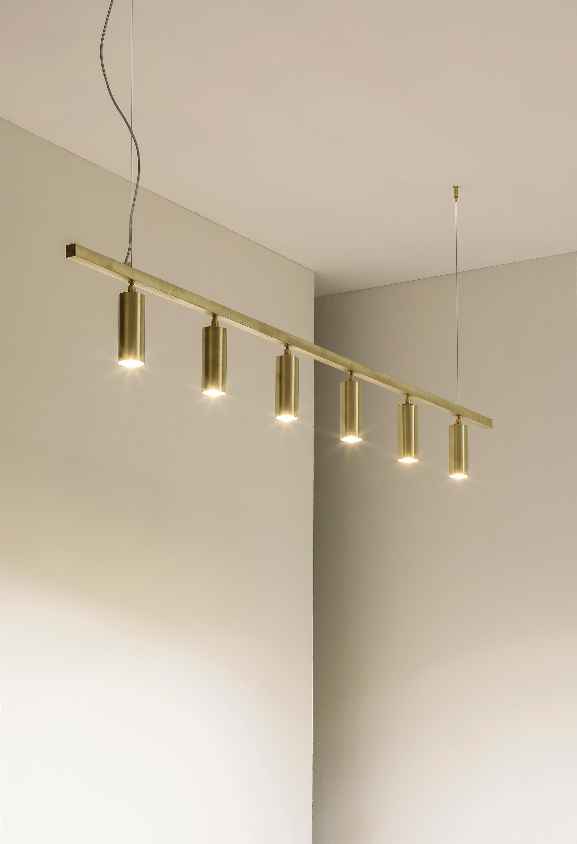 TF606 Suspension Lamp in Satin Brass with Orientable Tubular Diffusers by Daluce
Dimensions: D 55 x W 19 x H 200 cm. 
Materials: Brass.

Available in different finish options: light satin burnished brass, medium satin burnished brass, and dark satin