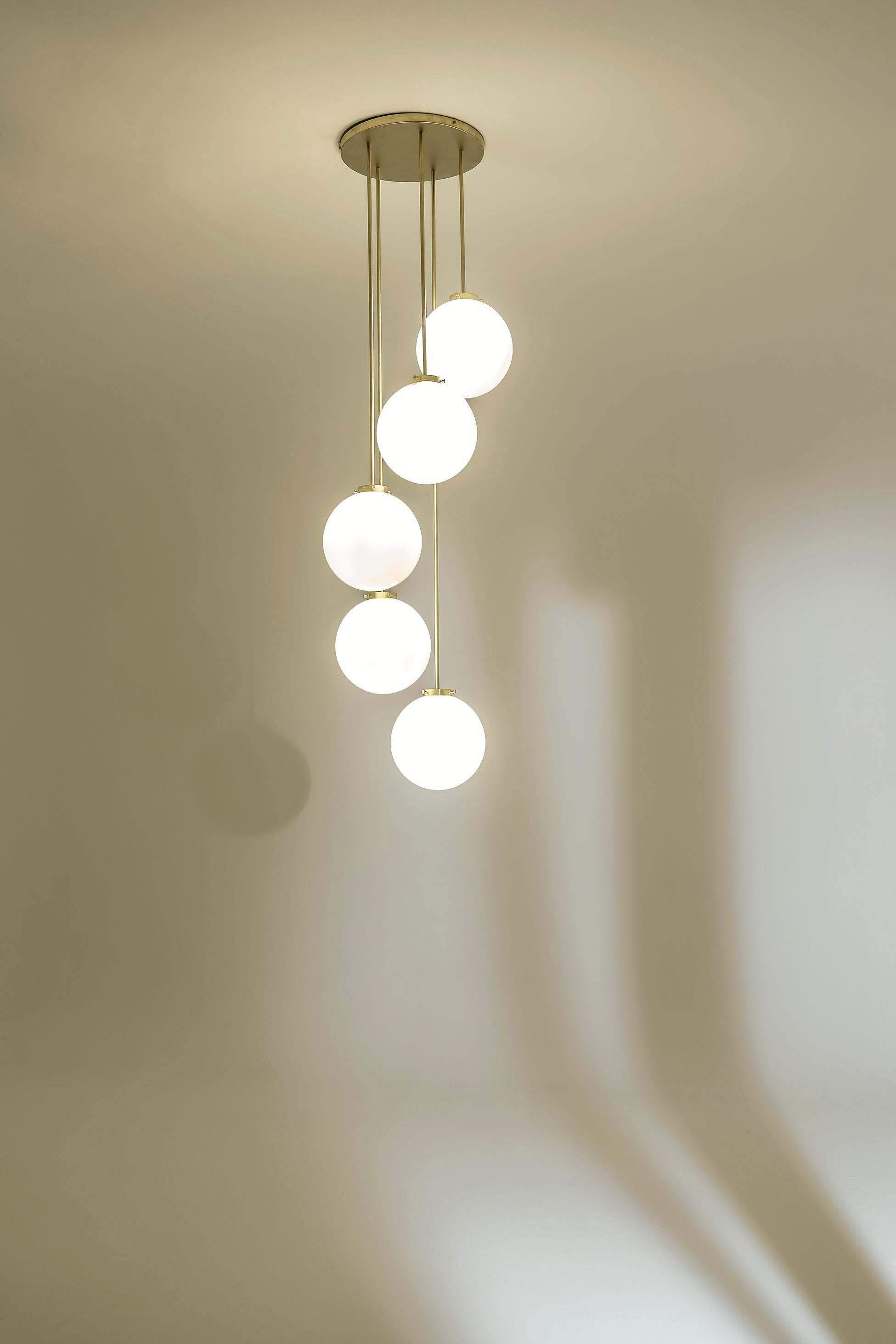 TF625 Suspension Lamp in Satin Brass with Blown Glass Spheres by Daluce
Dimensions: Ø 56,7 x H 240 cm. 
Materials: Brass and blown glass.

Available in different finish options: light satin burnished brass, medium satin burnished brass, and dark