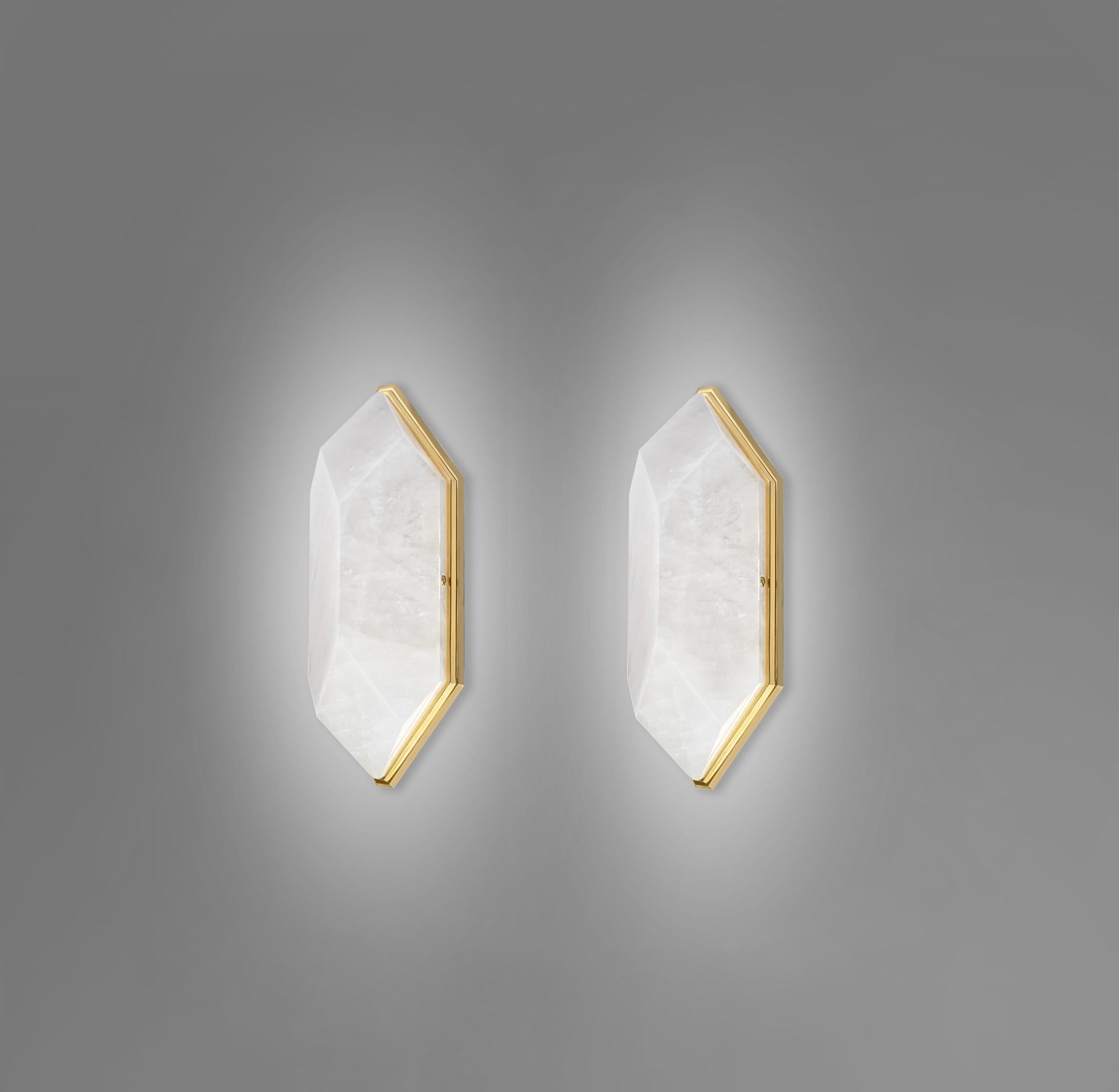 Pair of fine carved diamond form rock crystal sconces with polished brass mounts. Created by Phoenix Gallery.
Each sconce installs 2 sockets. 60 watts max each socket, total 120 watts.
  