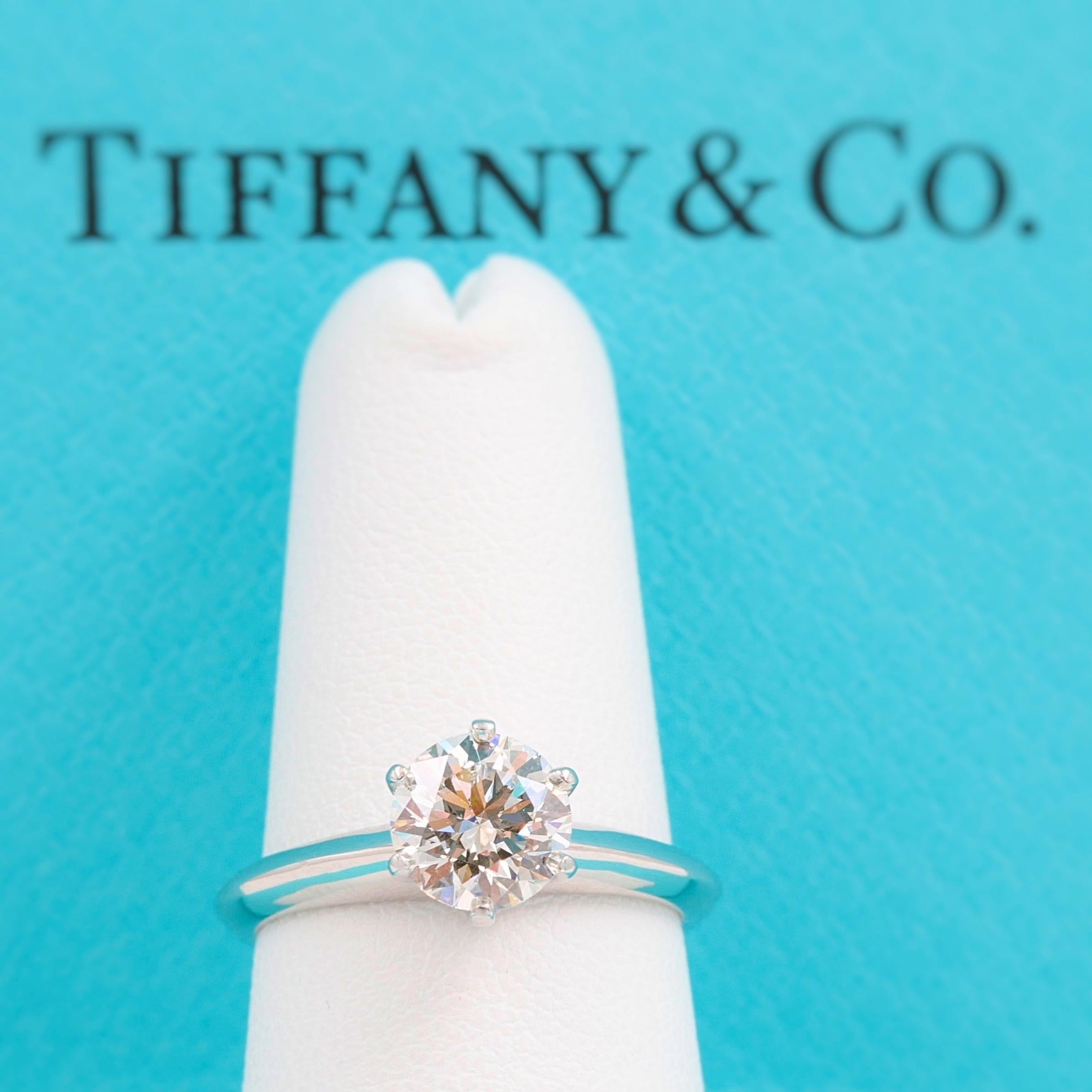 Tiffany & Co  Engagement Ring

Style:  TIFFANY Setting 
Metal:  Platinum PT950
Size:  6 - sizble
Total Carat Weight:  1.00 cts
Diamond Shape:  Round Brilliant 
Diamond Color & Clarity:  I - VS1
Hallmark:  ©TIFFANY&CO. PT950 25612612 1.00CT
Includes: