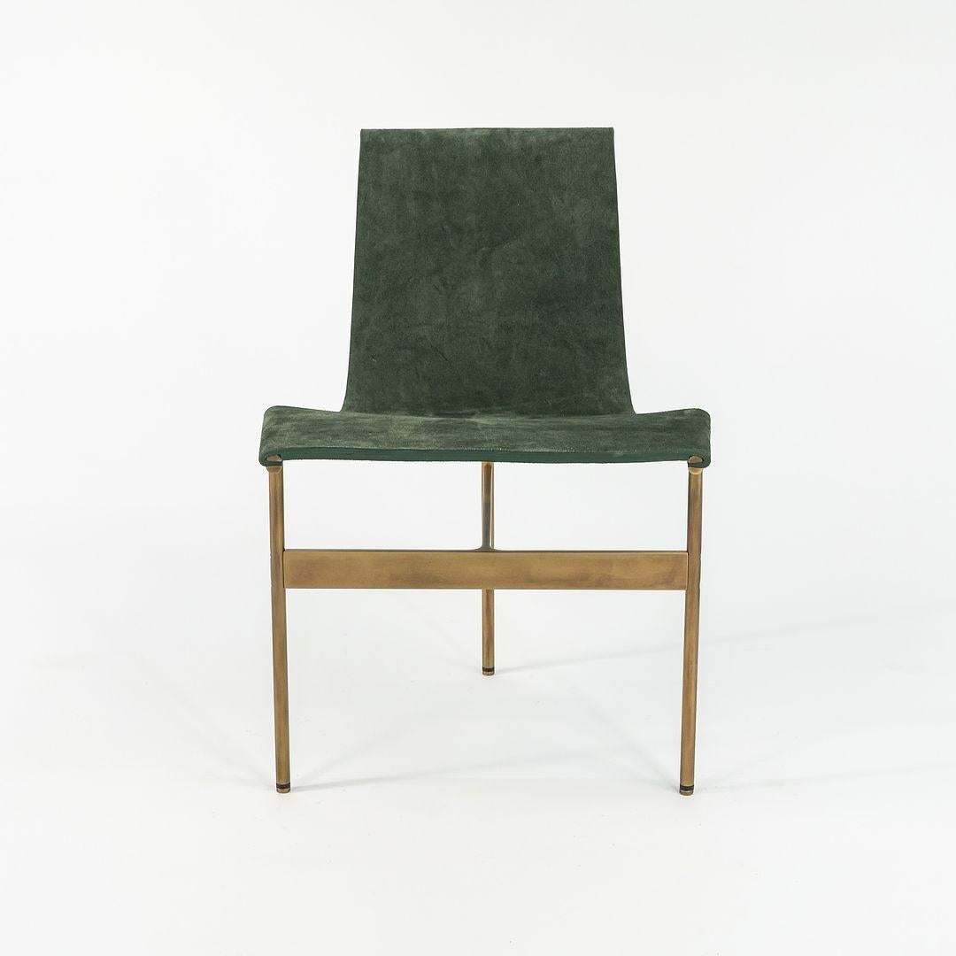 This is a TG-10 sling dining chair in green suede with a light antique bronze frame, produced by Gratz Industries. The chair was designed by Katavolos, Littell and Kelley in 1952 as part of the original Laverne Collection produced by Gratz