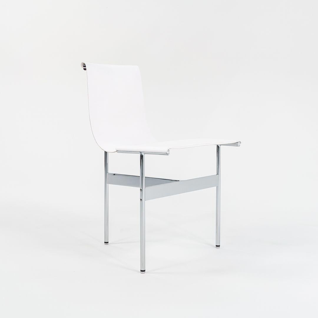 This is a TG-10 sling dining chair in white leather with a polished chrome frame, produced by Gratz Industries. The chair was designed by Katavolos, Littell and Kelley in 1952 as part of the original Laverne Collection produced by Gratz Industries,
