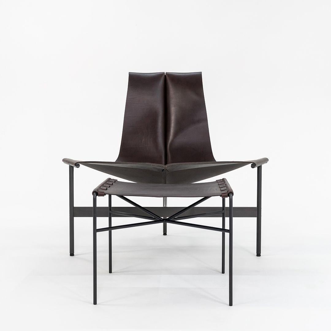 This is a TG-15 sling lounge chair with a TG-19 ottoman both in dark brown leather with blackened frames, produced by Gratz Industries. The chair and ottoman were designed by Katavolos, Littell and Kelley in 1952 as part of the original Laverne