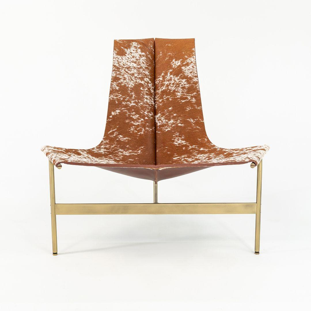 This is a TG-15 sling lounge chair in tan and white speckled hair on hide with a light antique bronze frame, produced by Gratz Industries. The chair was designed by Katavolos, Littell and Kelley in 1952 as part of the original Laverne Collection