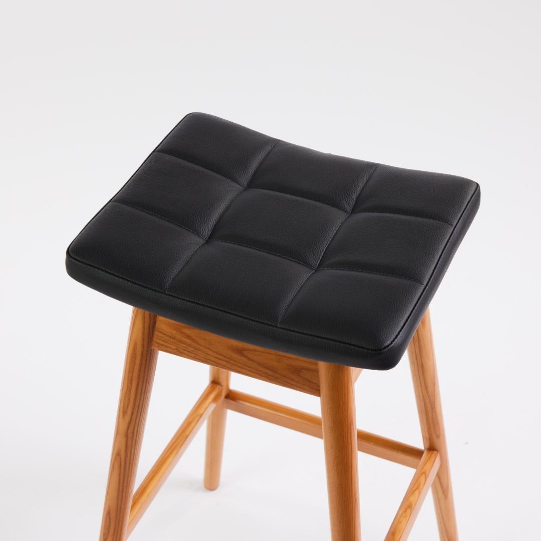 he TH Brown Martelle bar stool was first manufactured in the early 1960 and remains an iconic, timeless Australian design to this day. The beautifully sculpted fixed seat, angled legs and hand stitched upholstery remain as contemporary as the day