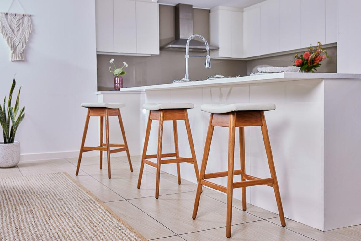 he TH Brown Martelle bar stool was first manufactured in the early 1960 and remains an iconic, timeless Australian design to this day. The beautifully sculpted fixed seat, angled legs and hand stitched upholstery remain as contemporary as the day