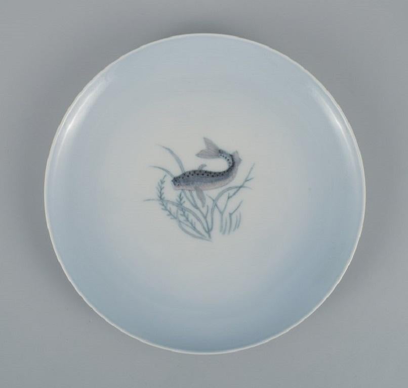 Th. Karlinder for Bing & Grondahl.
Six hand painted porcelain dinner plates with fish motifs.
1956.
In excellent condition.
First factory quality.
Marked.
Dimensions: D 23.5 cm.