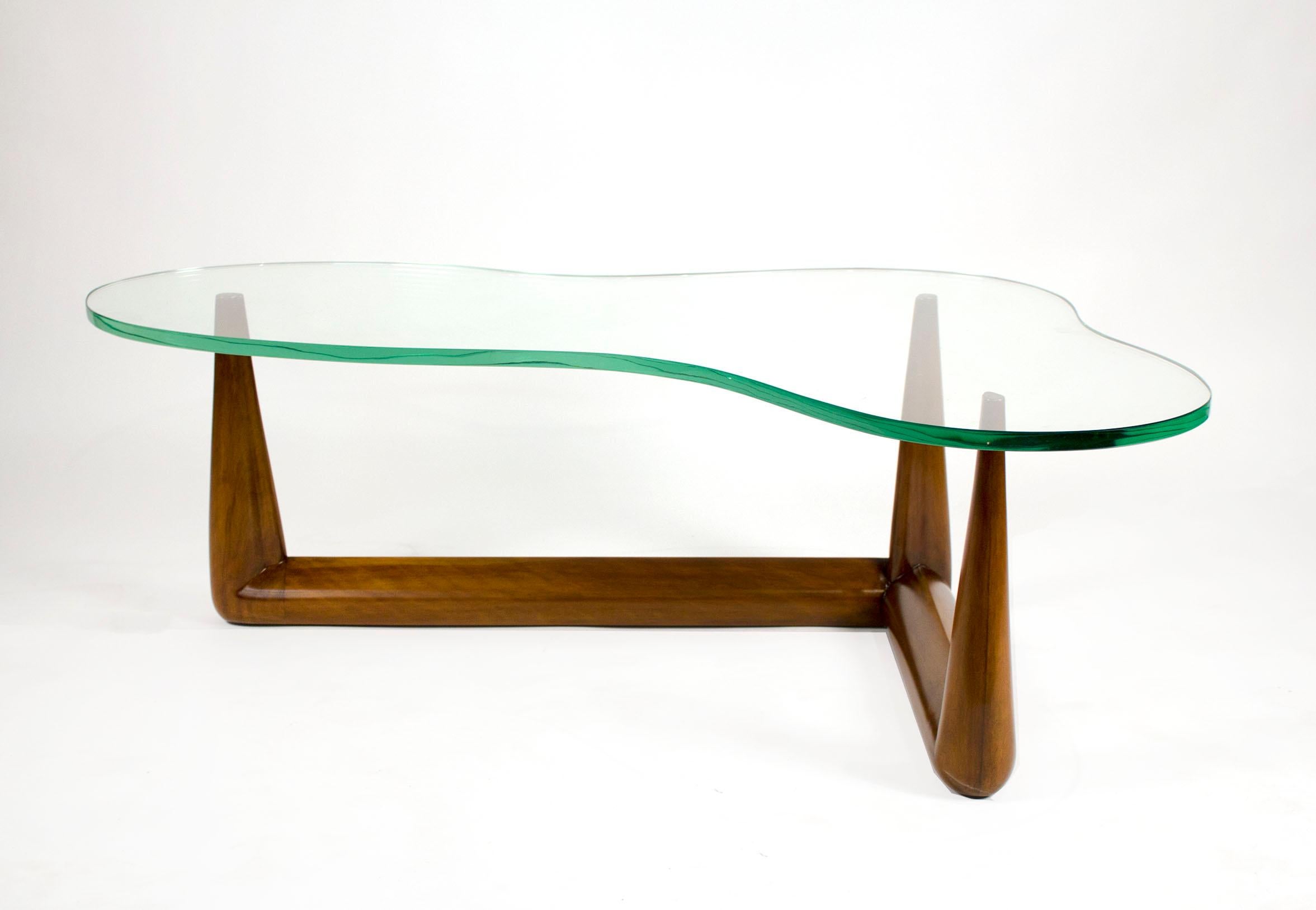 T.H. Robsjohn-Gibbings Biomorphic Cocktail Table w Interesting Anecdote of Isamu Noguchi.

Widdicomb cocktail table with architectural grade green edge biomorphic glass top and solid carved maple sculptural base. 

If you have not read the story of