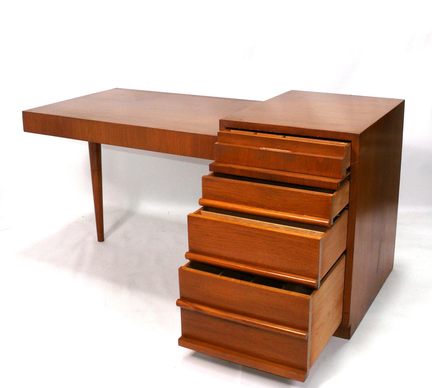Clean lined cantilevered modern desk, designed by T.H. Robsjohn-Gibbings for Widdicomb, American, circa 1950s. This desk is currently being refinished and can be completed in your choice of finish color. The price noted below includes refinishing in