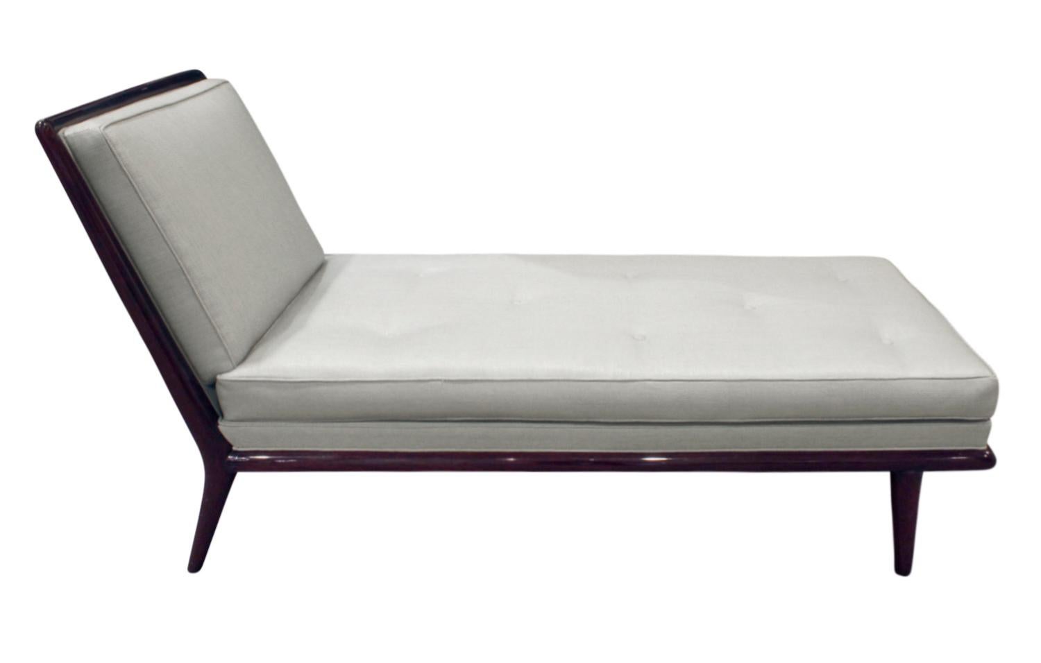 Chaise lounge No. 1708 upholstered in pale blue linen with walnut frame designed by T.H. Robsjohn-Gibbings for Widdicomb, American, 1950s.  This is an iconic design by one of America’s most important mid-century designers.