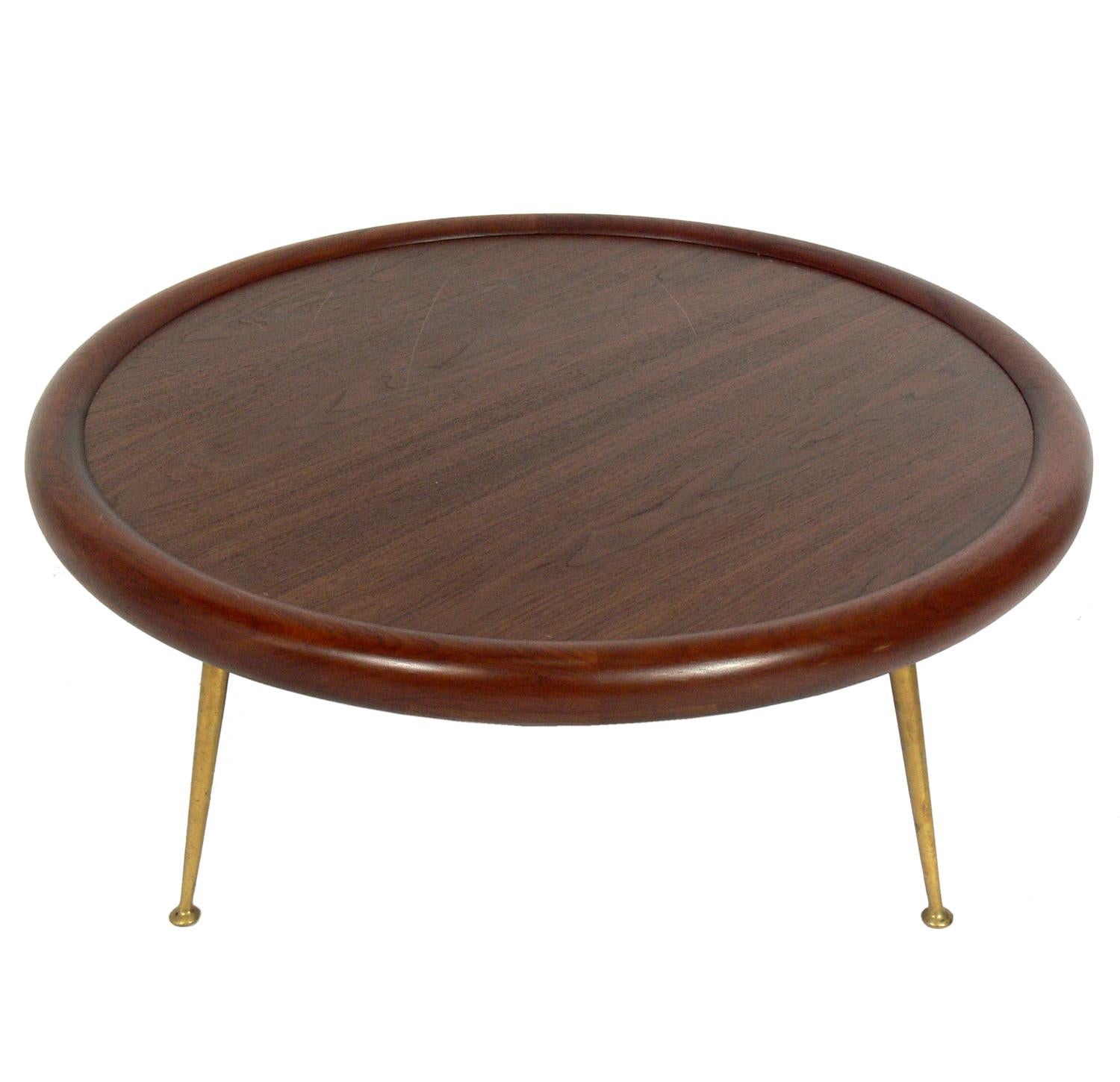 Glamorous Coffee Table or Ottoman, designed by T.H. Robsjohn Gibbings for Widdicomb, American, circa 1950s. The cushion is removable so that it can be used as a coffee table or ottoman or pouf. It has been refinished in a walnut color and