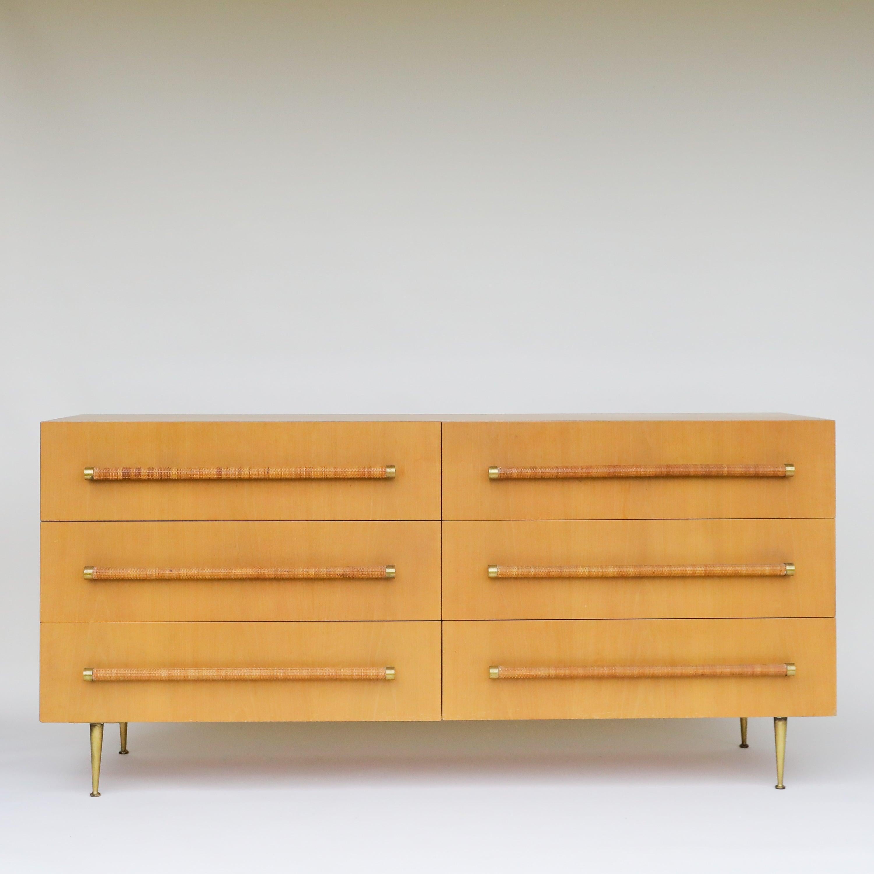 

A  stylish modern dresser designed by British-born architect T.H. Robsjohn Gibbings for Widdicomb in the United States, circa 1950s. This striking design features a walnut wood case with six drawers and solid brass legs perfectly complementing the