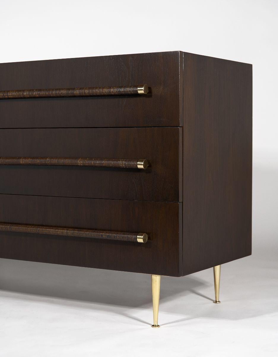 1950s Widdicomb Cabinet designed by TH Robsjohn Gibbings and fully restored in a deep espresso stain with a satin lacquer finish over the original mahogany. All of the solid brass hardware and feet have been polished and re-sealed. The interiors are