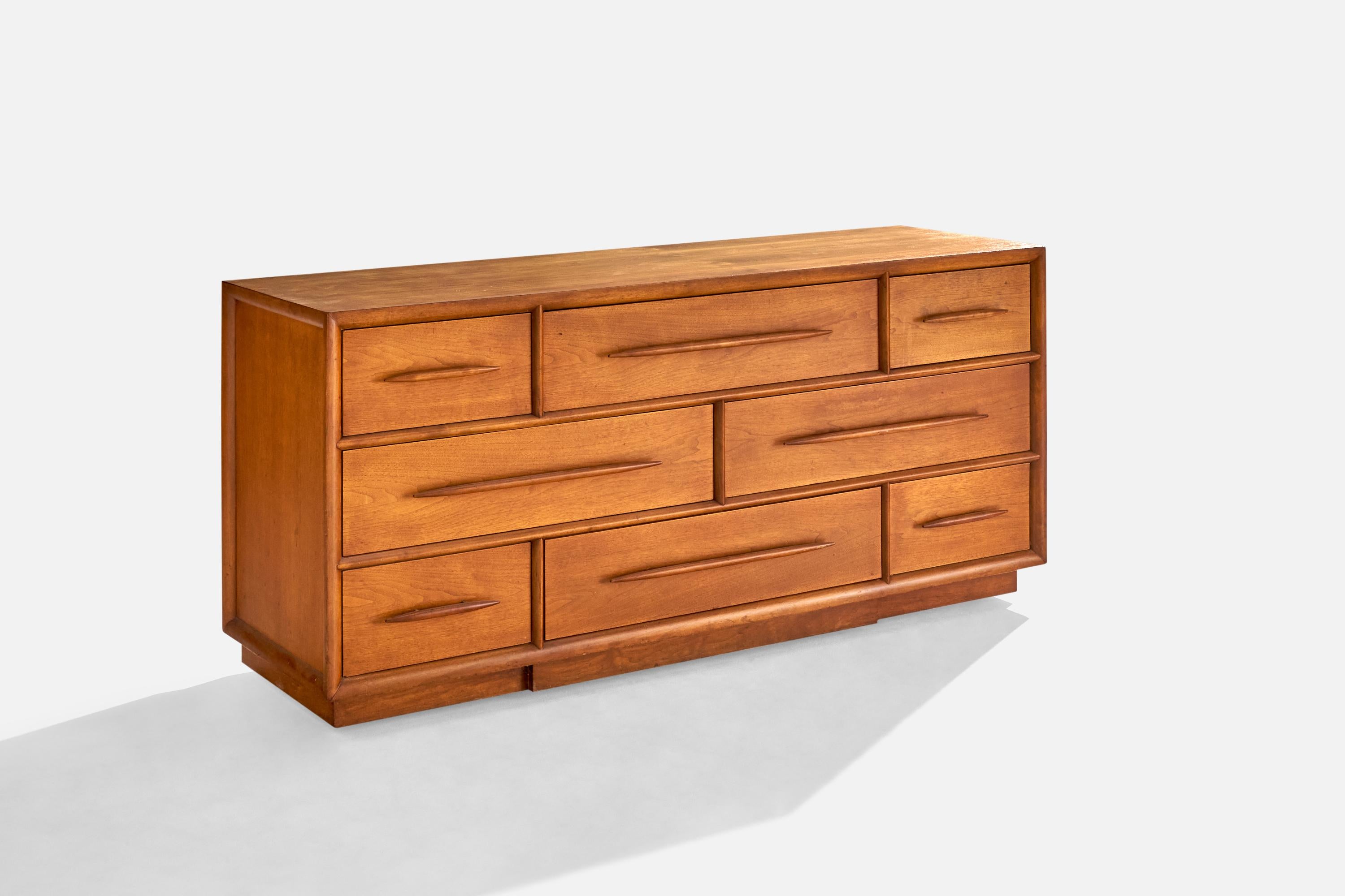 A rare walnut dresser designed by T.H. Robsjohn-Gibbings and produced by Widdicomb, Grand Rapids, Michigan, USA, 1950s.
