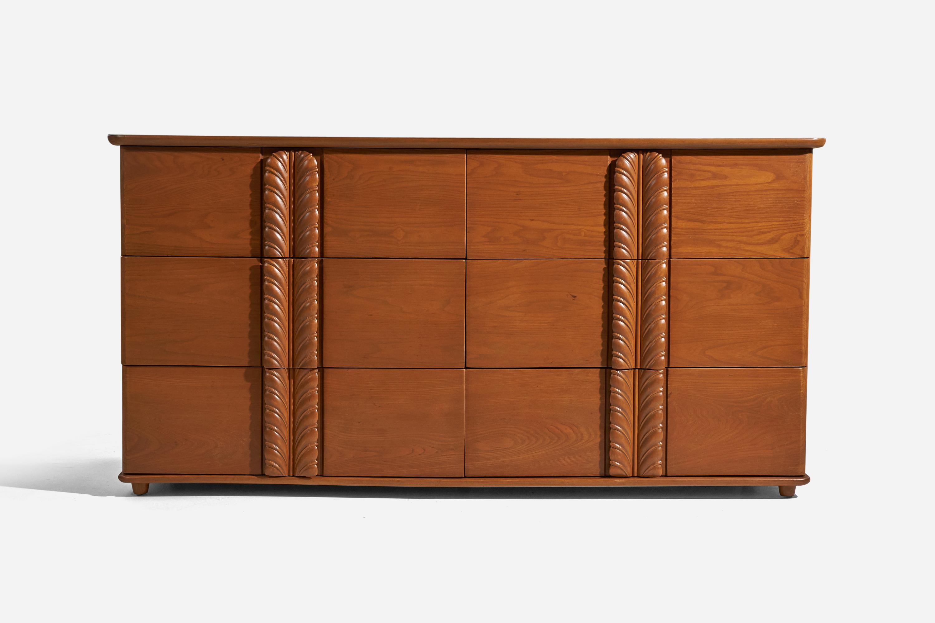 A walnut dresser designed by T.H. Robsjohn-Gibbings and produced by Widdicomb Furniture Company, America, 1950s.
 