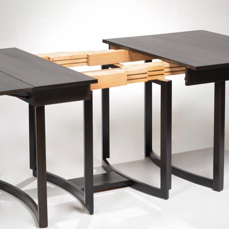 Robsjohn-Gibbings for Widdicomb ebonized mahogany drop-leaf extendable dining table with one leaf. Completely folded the table measures: 26 x 40 x 29