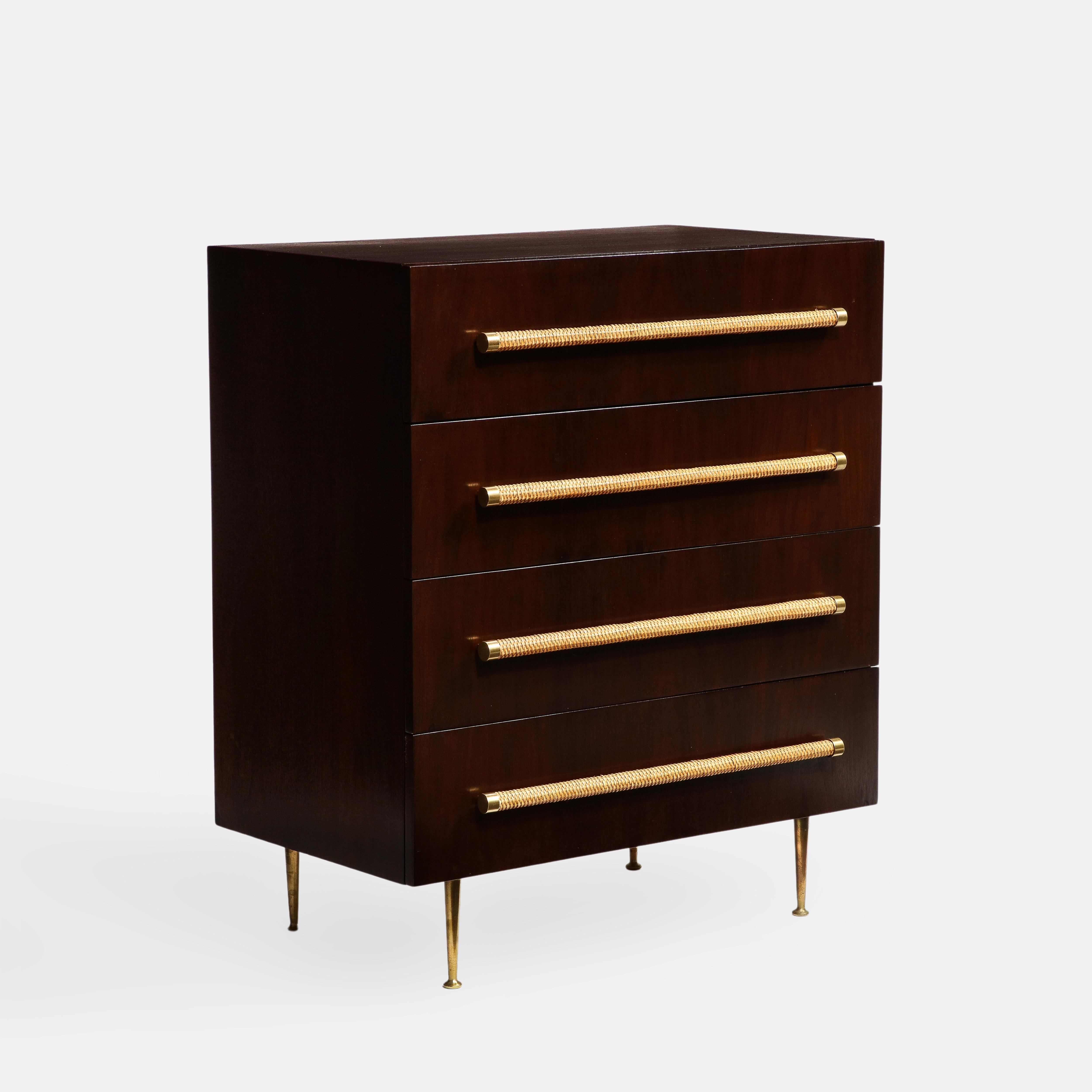 T.H. Robsjohn-Gibbings for Widdicomb Fuirniture Co. dresser or chest of drawers in dark stained walnut with four circular woven rattan handles and brass end caps ending on tapering brass legs with circular brass feet.  This exquisitely crafted chest