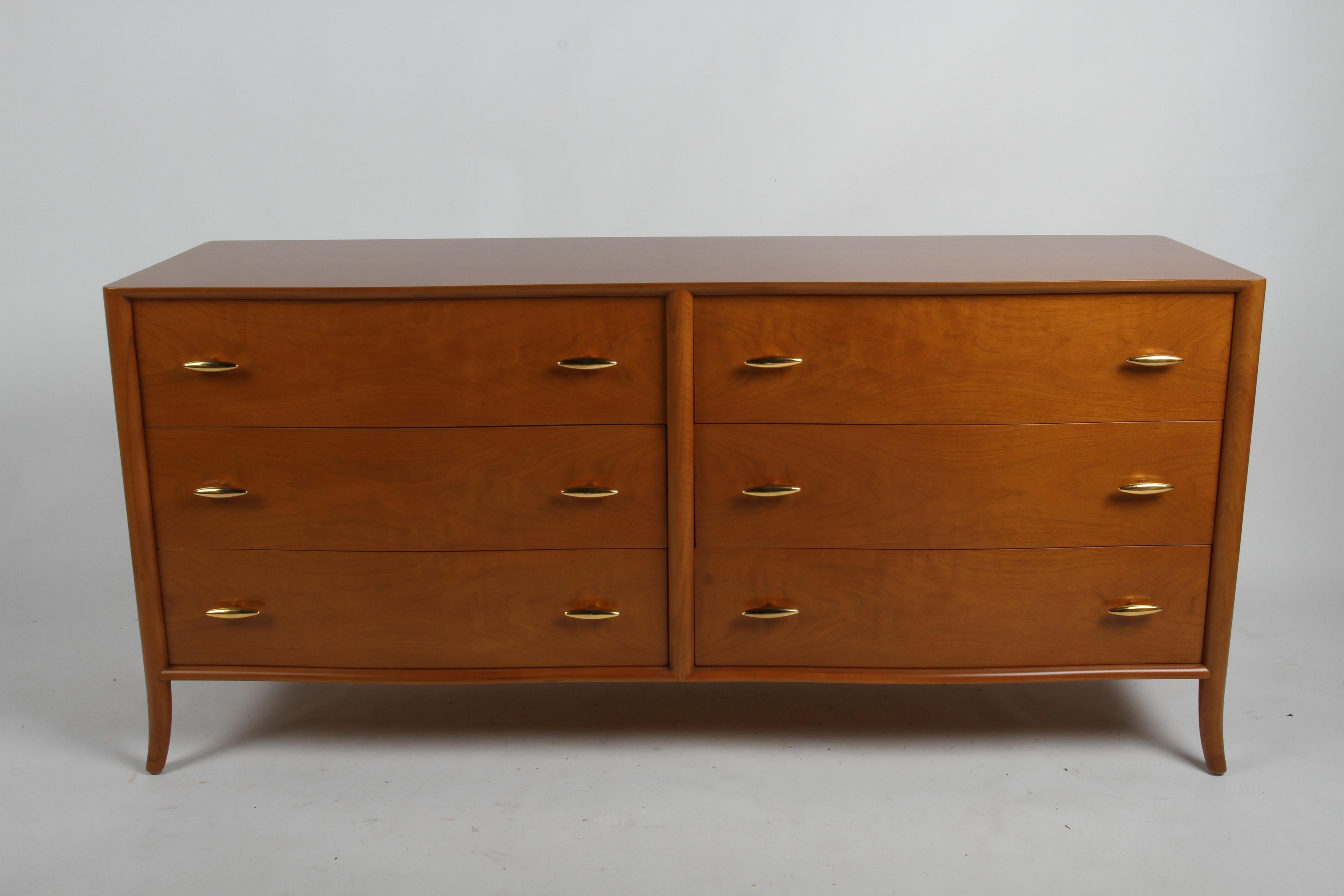 Rare and very elegant Mid Century T.H. Robsjohn-Gibbings for Widdicomb, 6 drawer walnut dresser, subtle serpentine form front with splayed legs, custom 22-carat gold porcelain hardware. Only slight loss / wear to some of the handles at their points.