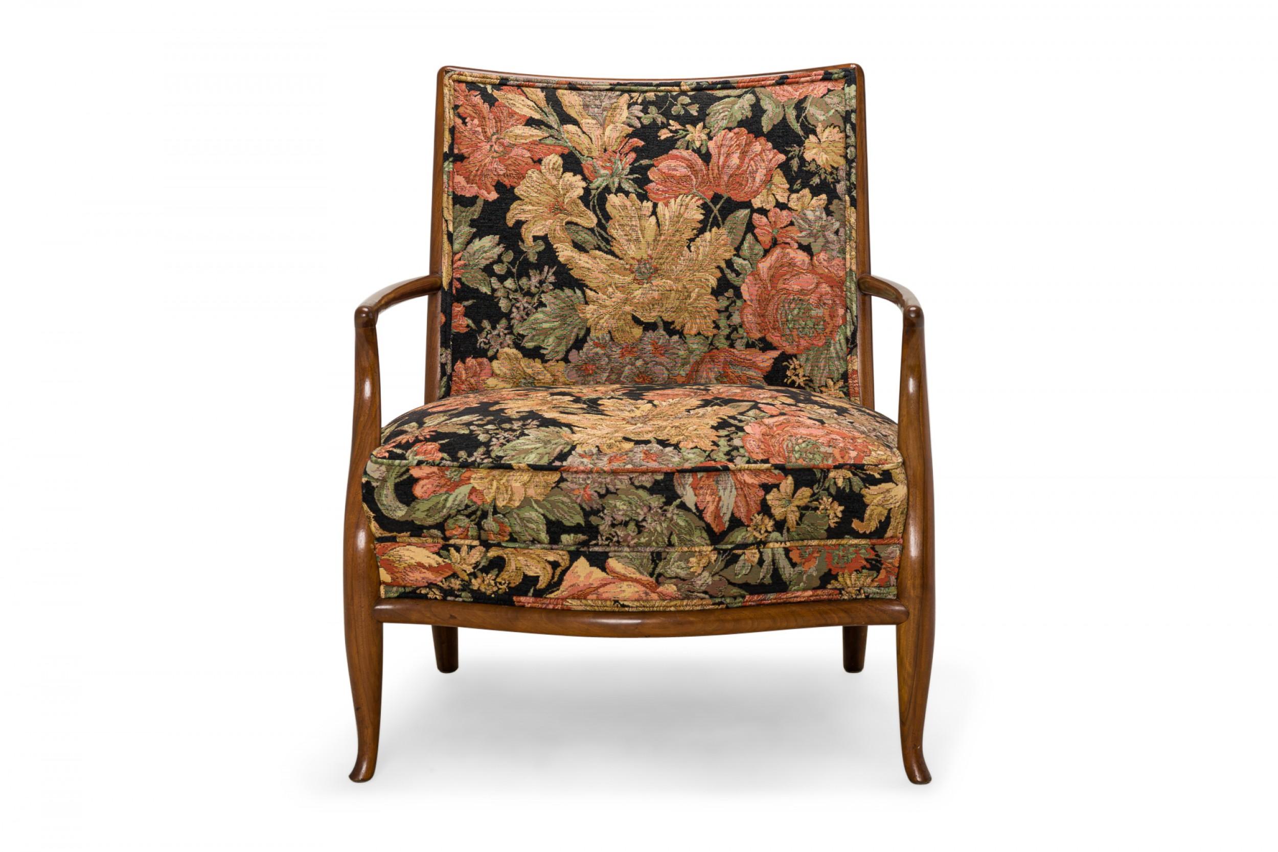 American mid-century 'French' lounge / armchair with a shaped walnut frame, square back, and multi-colored floral back and seat upholstery, resting on four gently curved walnut legs. (T.H. ROBSJOHN GIBBINGS FOR WIDDICOMB FURNITURE CO.)
 