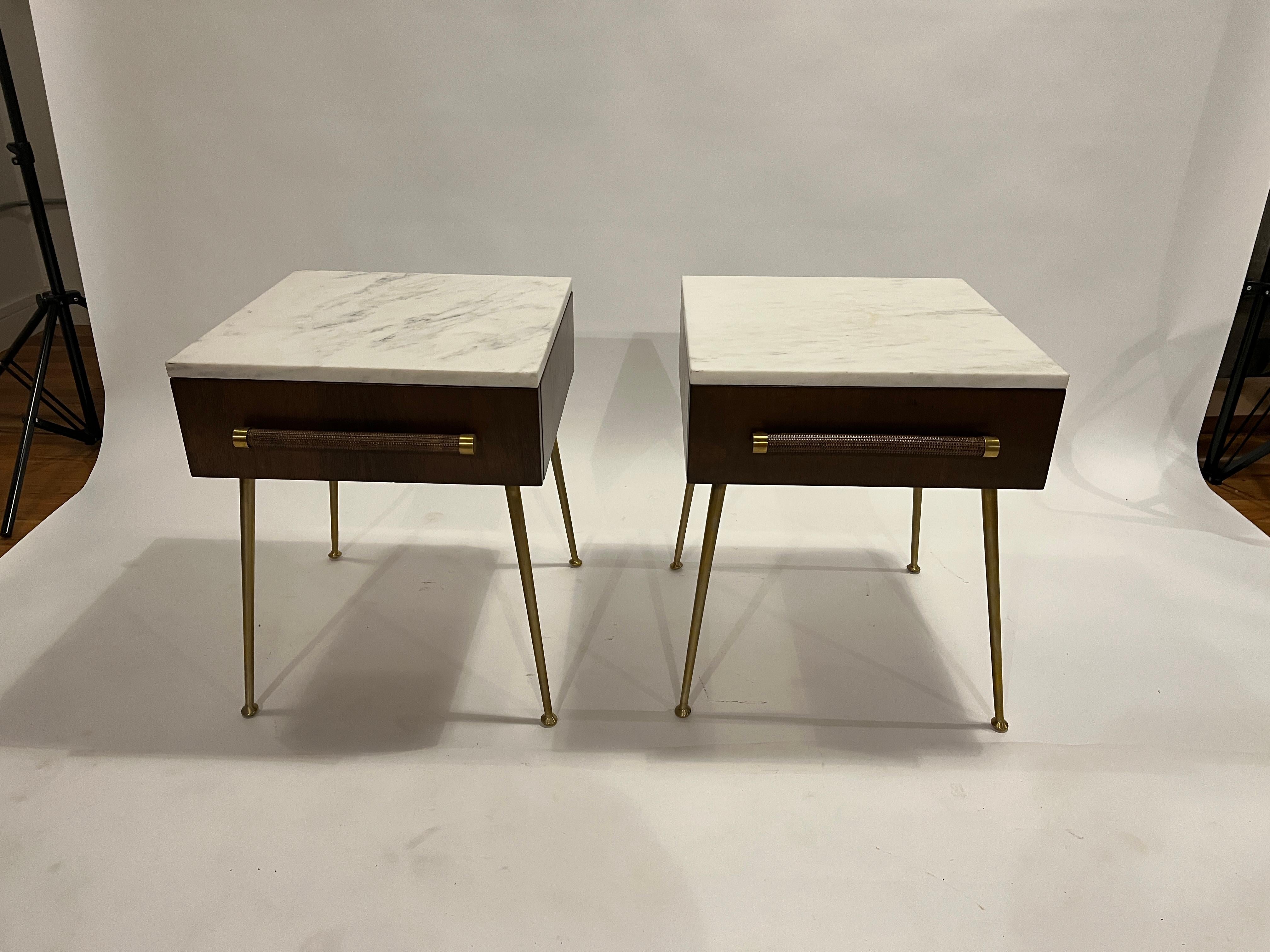 Glove box nightstands model #4001 designed by T.H. Robjohn Gibbings for Widdicomb, 1950s. Restored walnut box with a single pull-out drawer with cane and brass accent handles. Stands on brushed brass tapered legs, original label in the drawer.
These