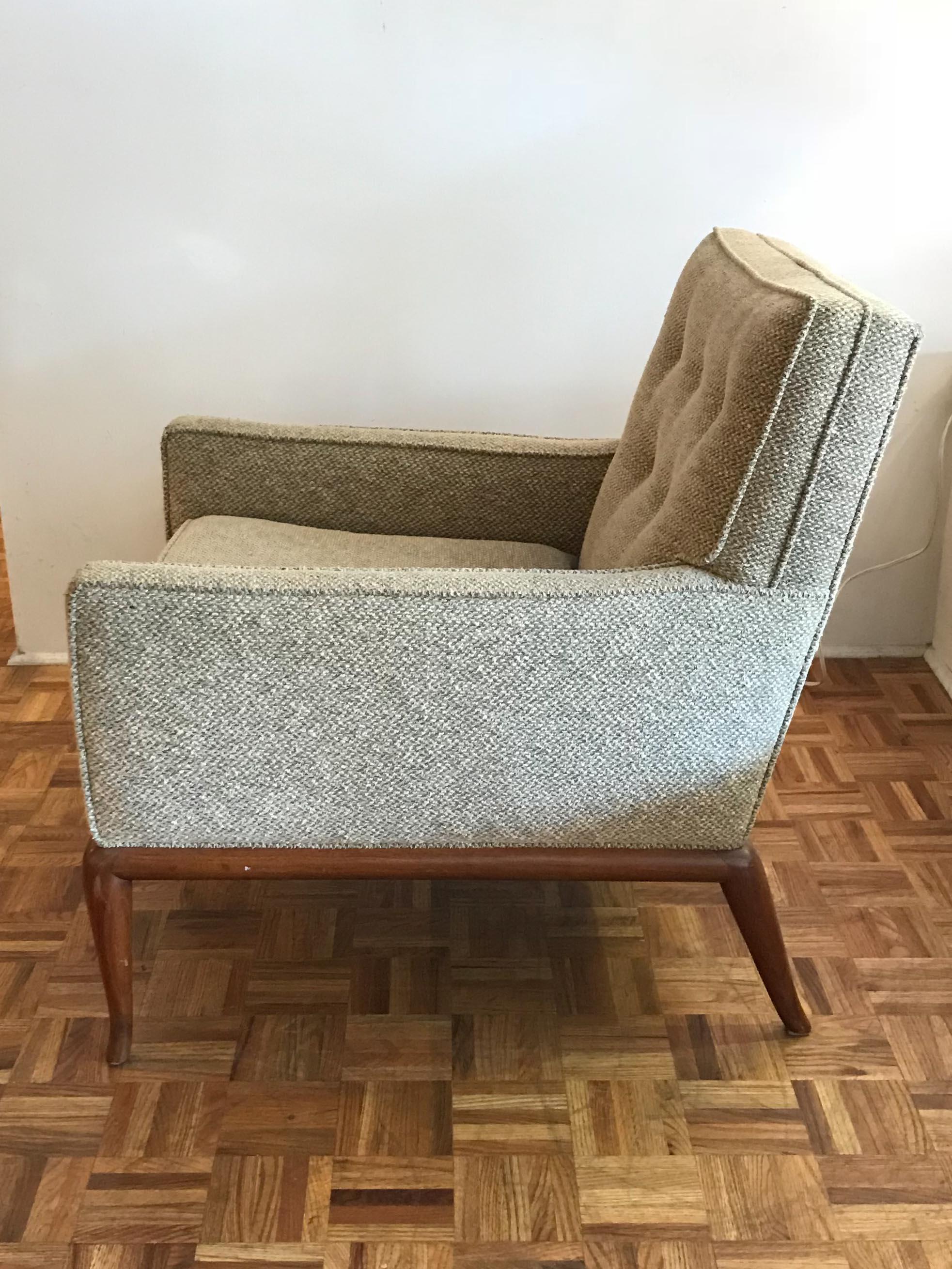 Pair of elegant T.H. Robsjohn-Gibbings for Widdicomb armchairs. Walnut frames with what looks to be original upholstery. Frames are in vintage condition with minor wear consistent with age and use.