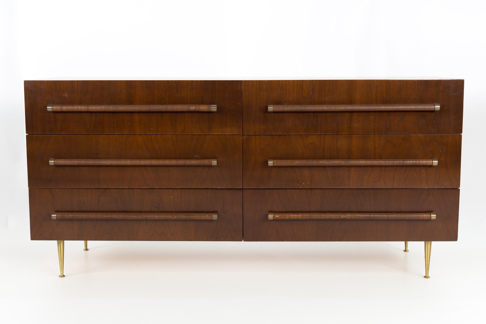 T.H. Robsjohn-Gibbings for Widdicomb Mid Century mahogany brass and wicker long lowboy dresser
Measures: 68 wide x 22 deep x 32.25 inches high

This price includes getting this piece in what we call restored vintage condition. That means the piece